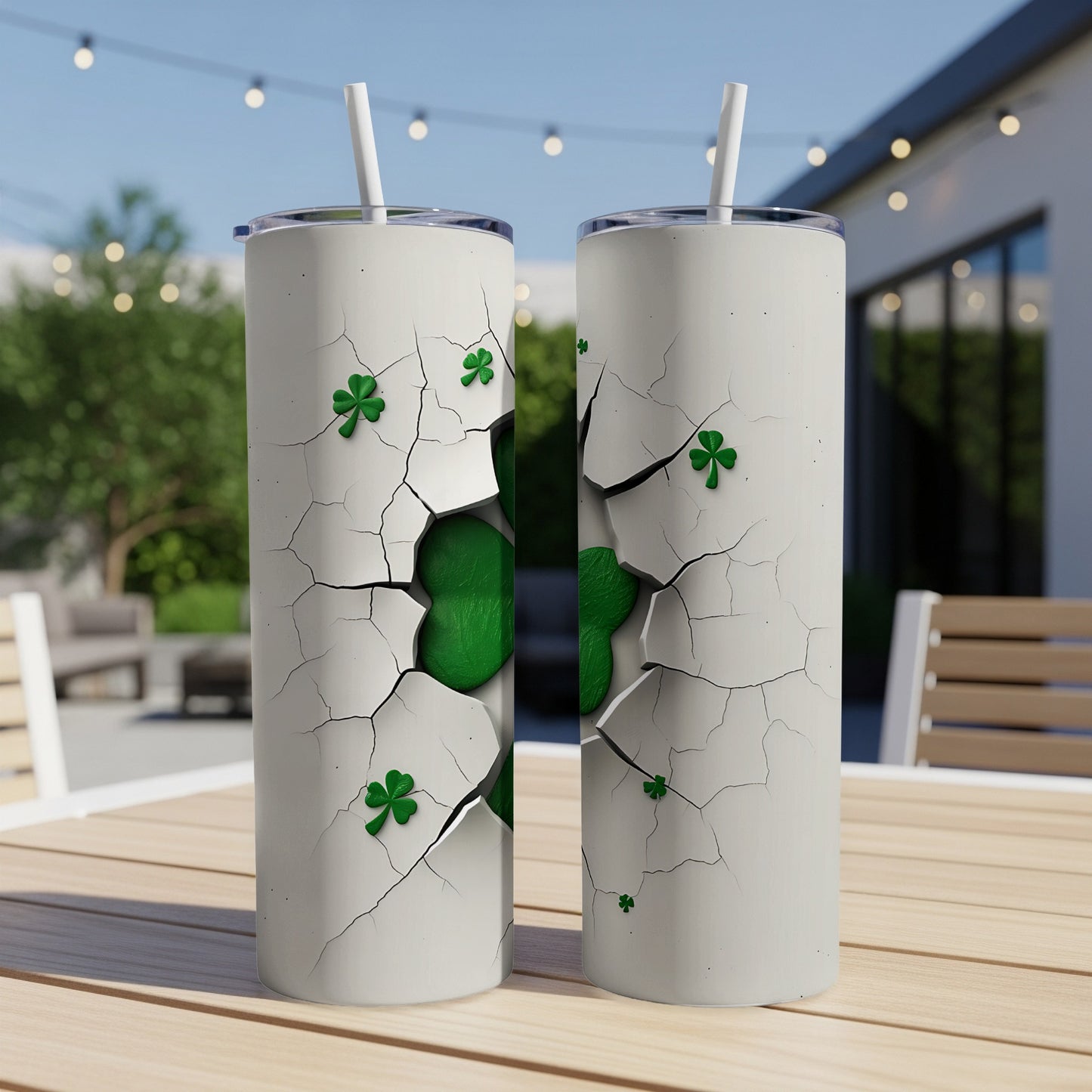 Two cracked tumblers reveal a bright green shamrock design.