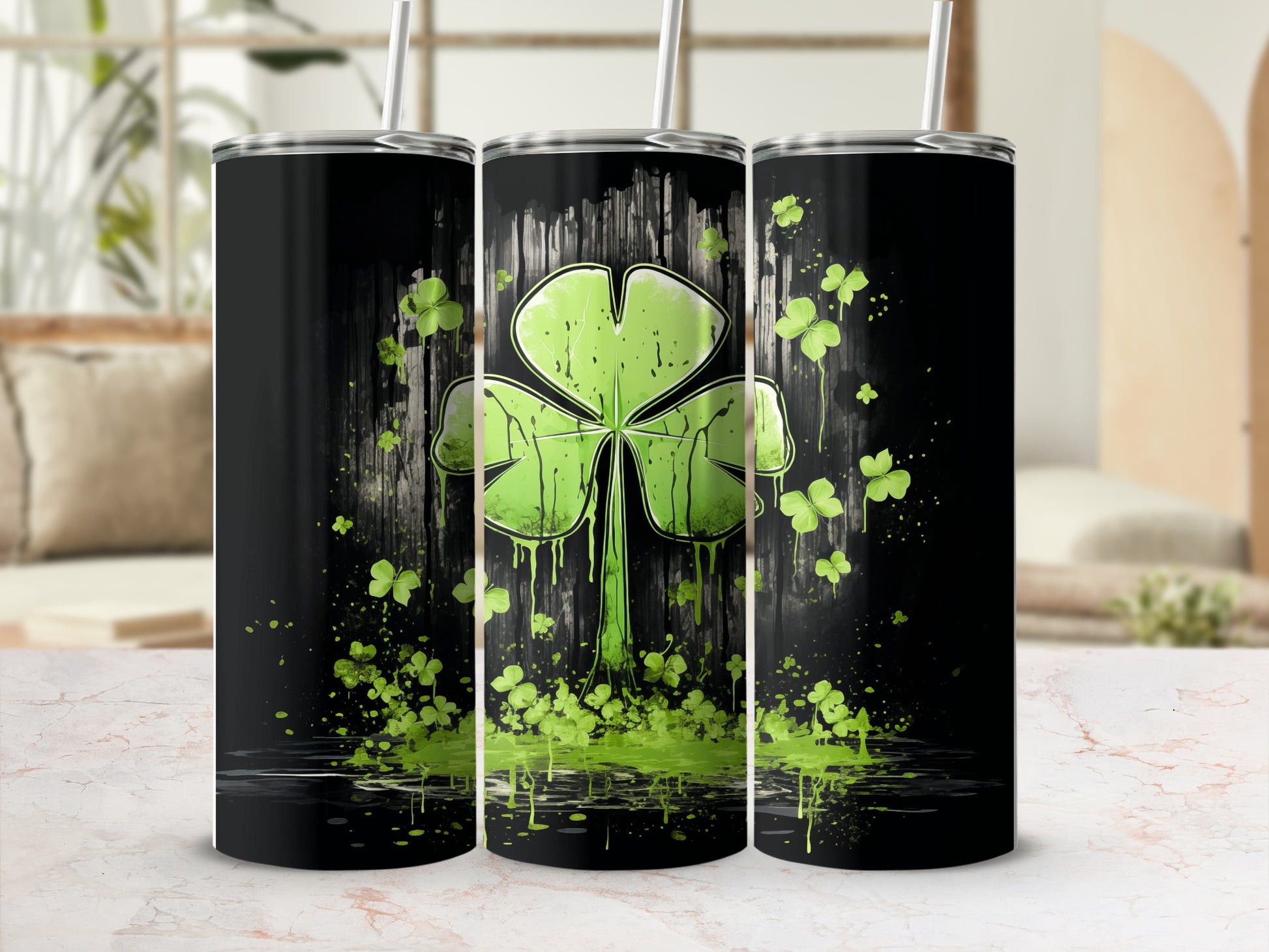 Black tumbler with a large green shamrock and scattered smaller shamrocks.