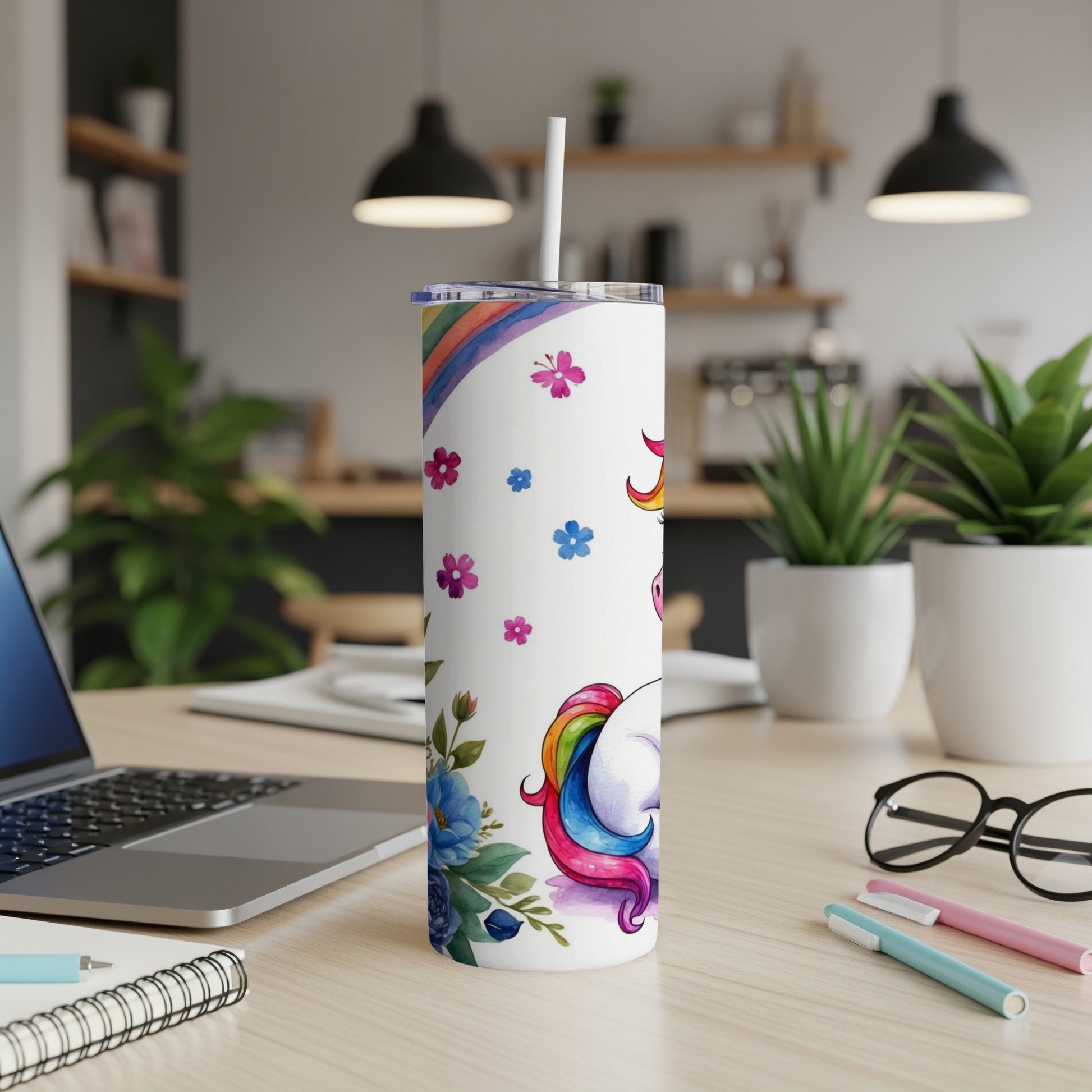 White tumbler with unicorn and floral design, straw.