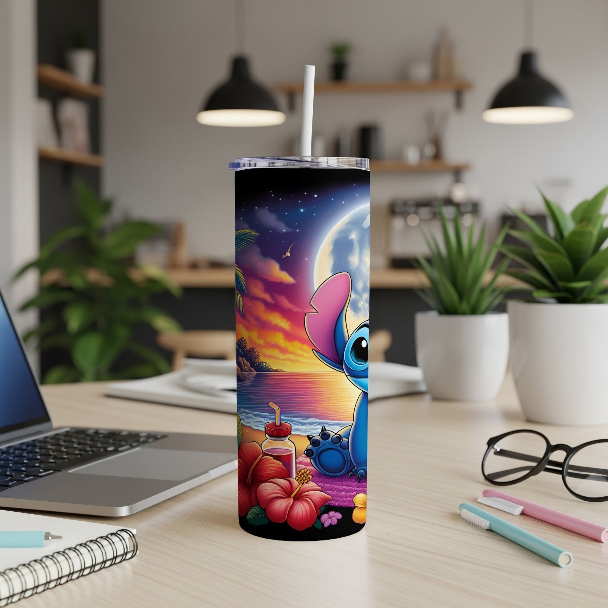Stitch tumbler with beach scene and moon, on desk.