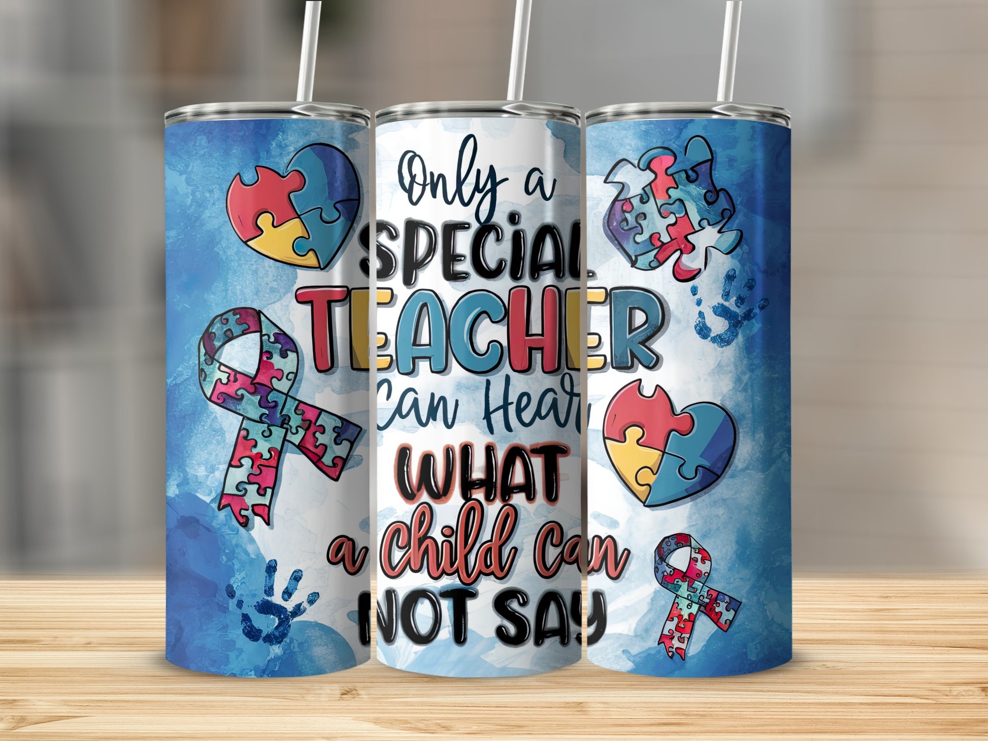 Teacher tumbler with autism awareness puzzle pieces and ribbon.