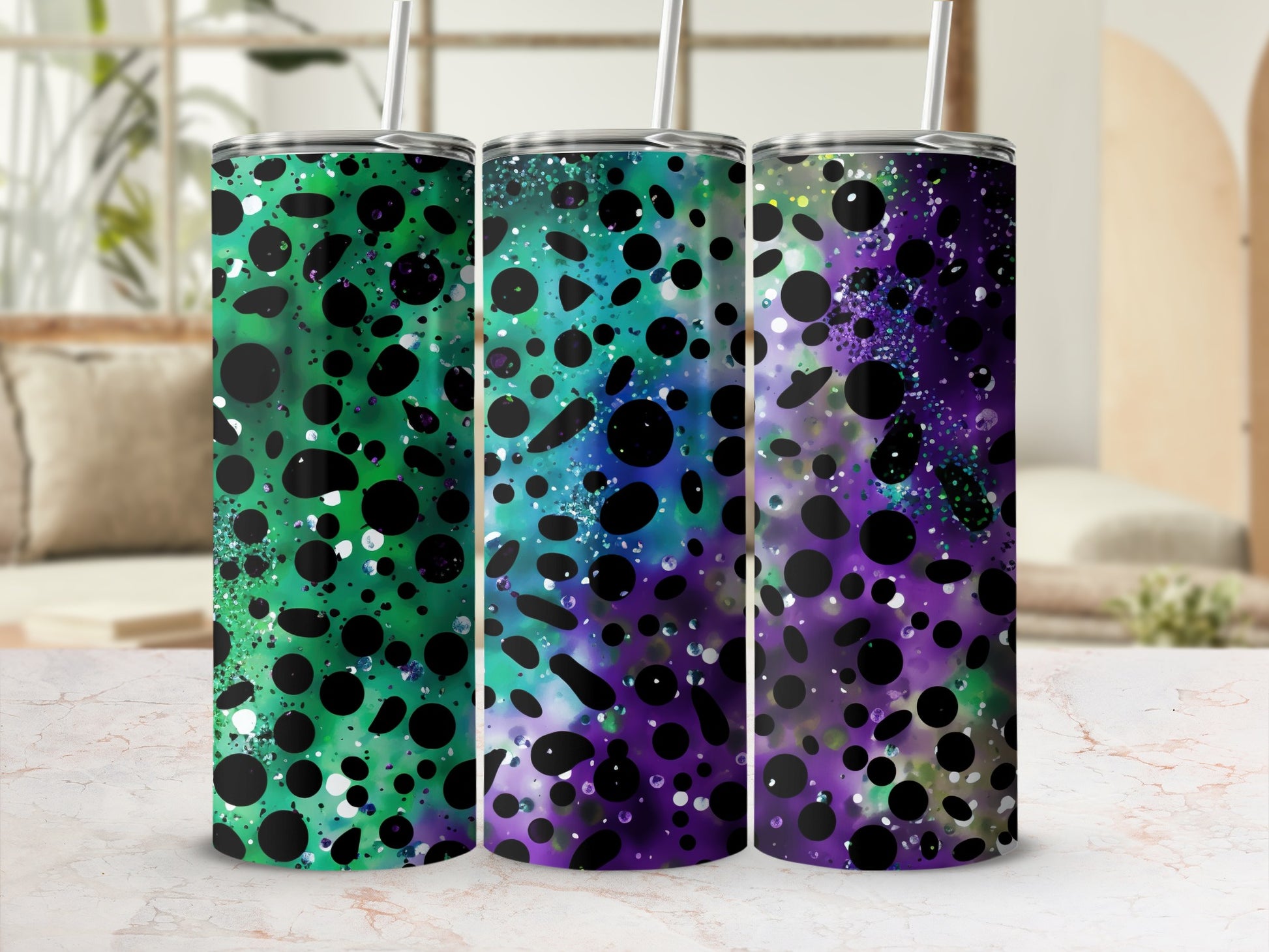 Three tumblers with colorful speckled abstract designs.