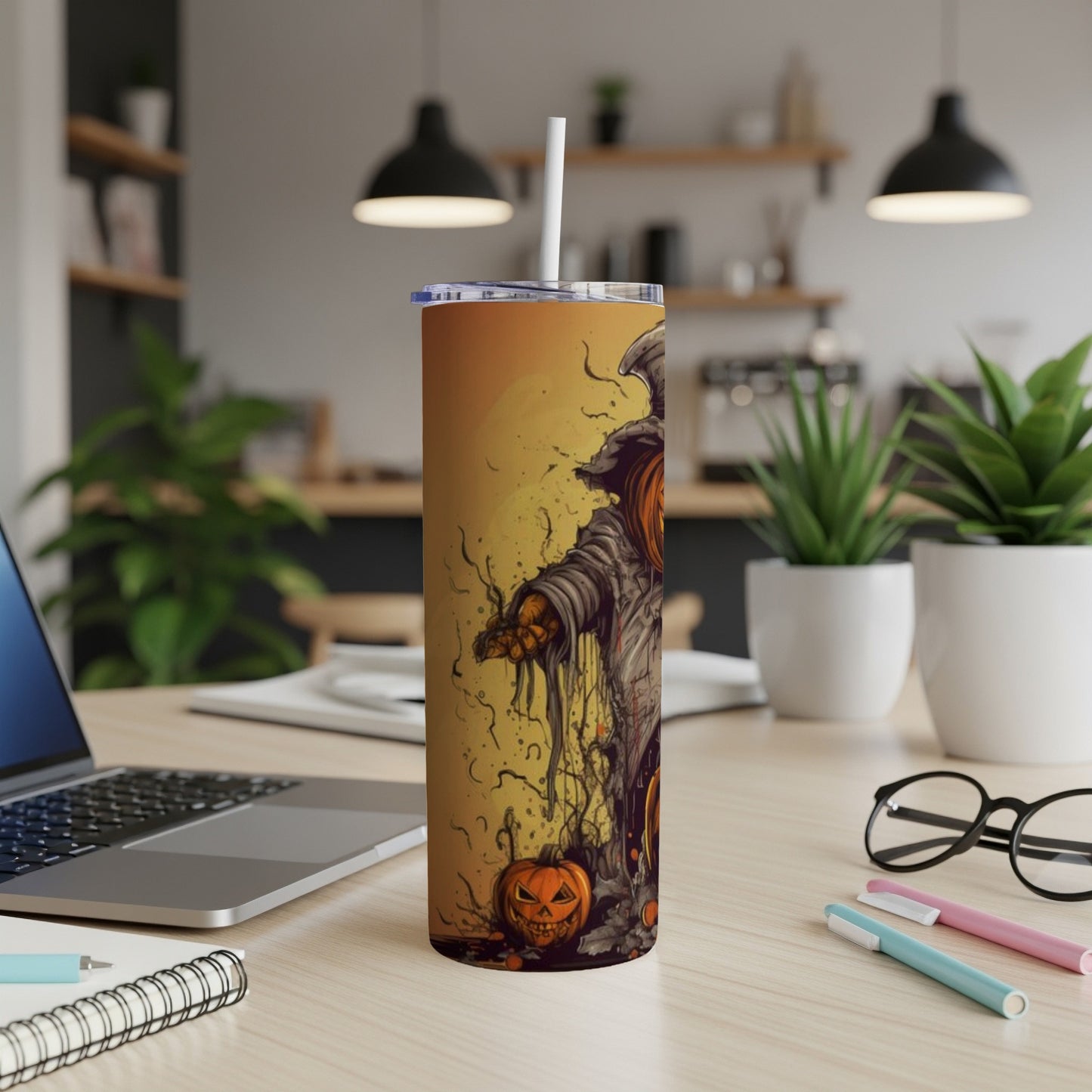 Halloween tumbler with scarecrow and jack-o-lantern design.