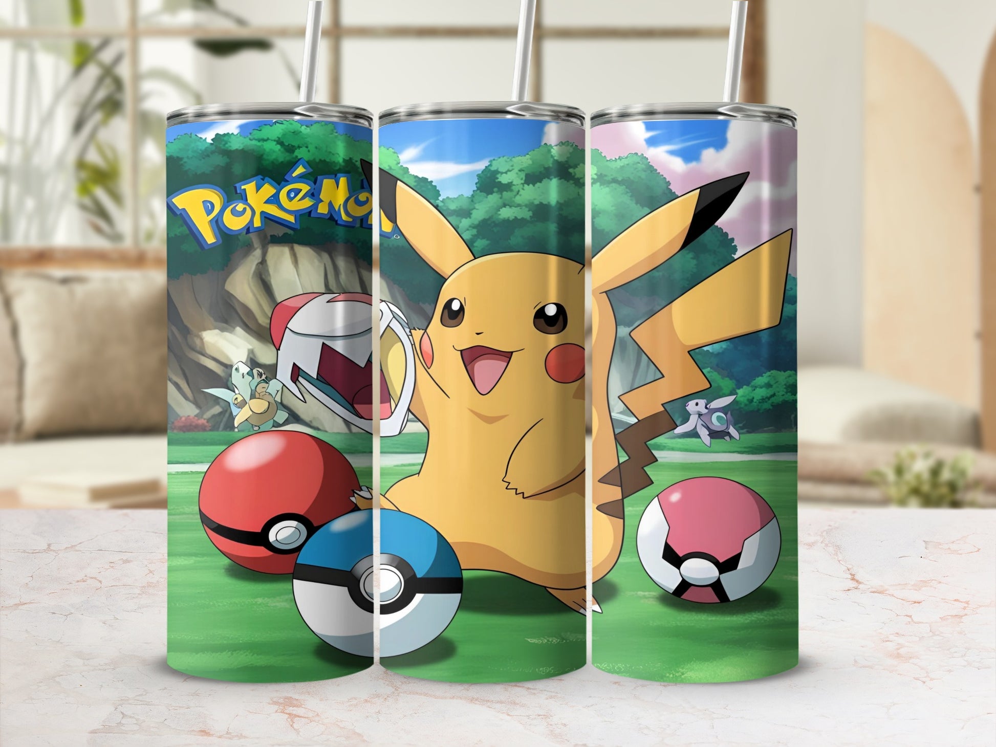 Three Pokémon tumblers featuring Pikachu and Poké Balls on a grassy background.