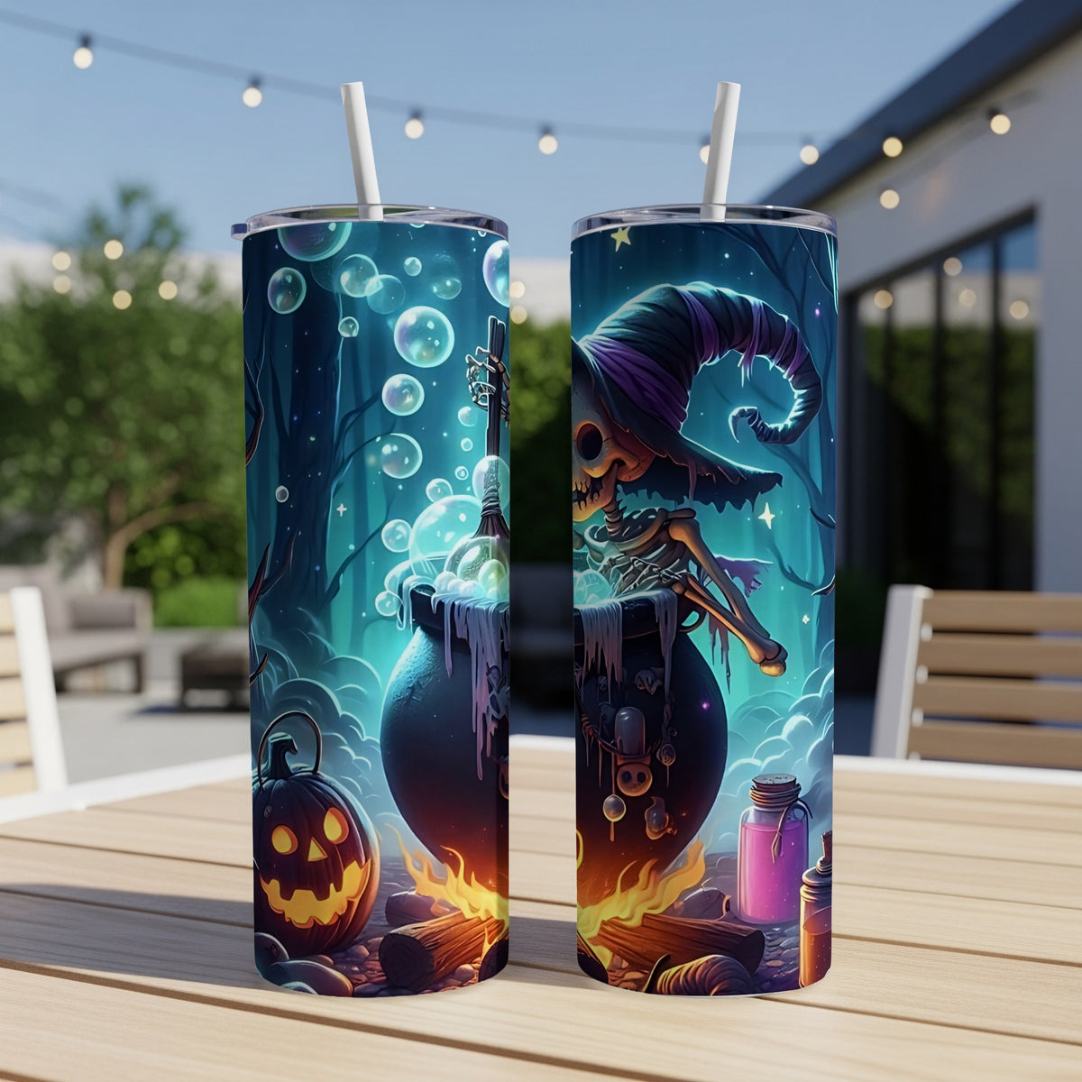Two Halloween-themed tumblers with a witch, cauldron, and pumpkin design.