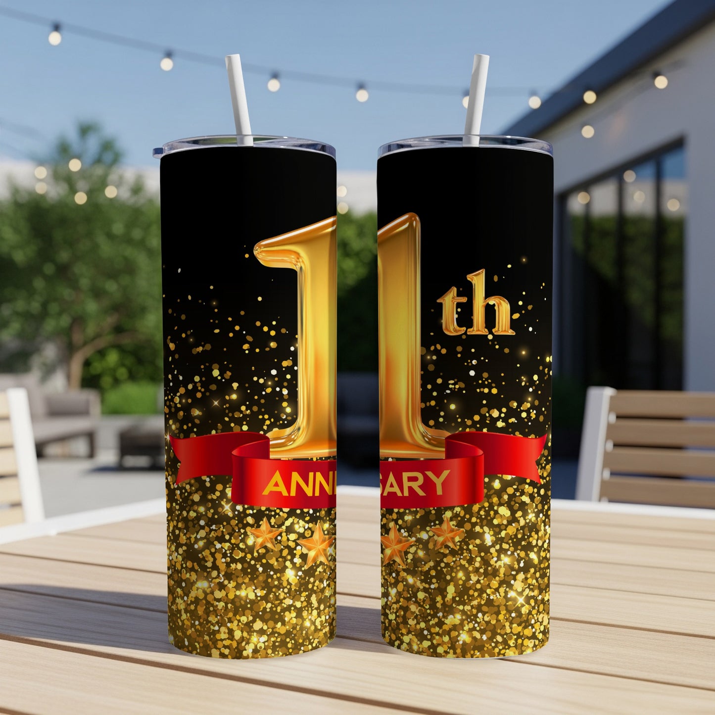 Gold "11th Anniversary" text with stars and confetti on black tumblers.
