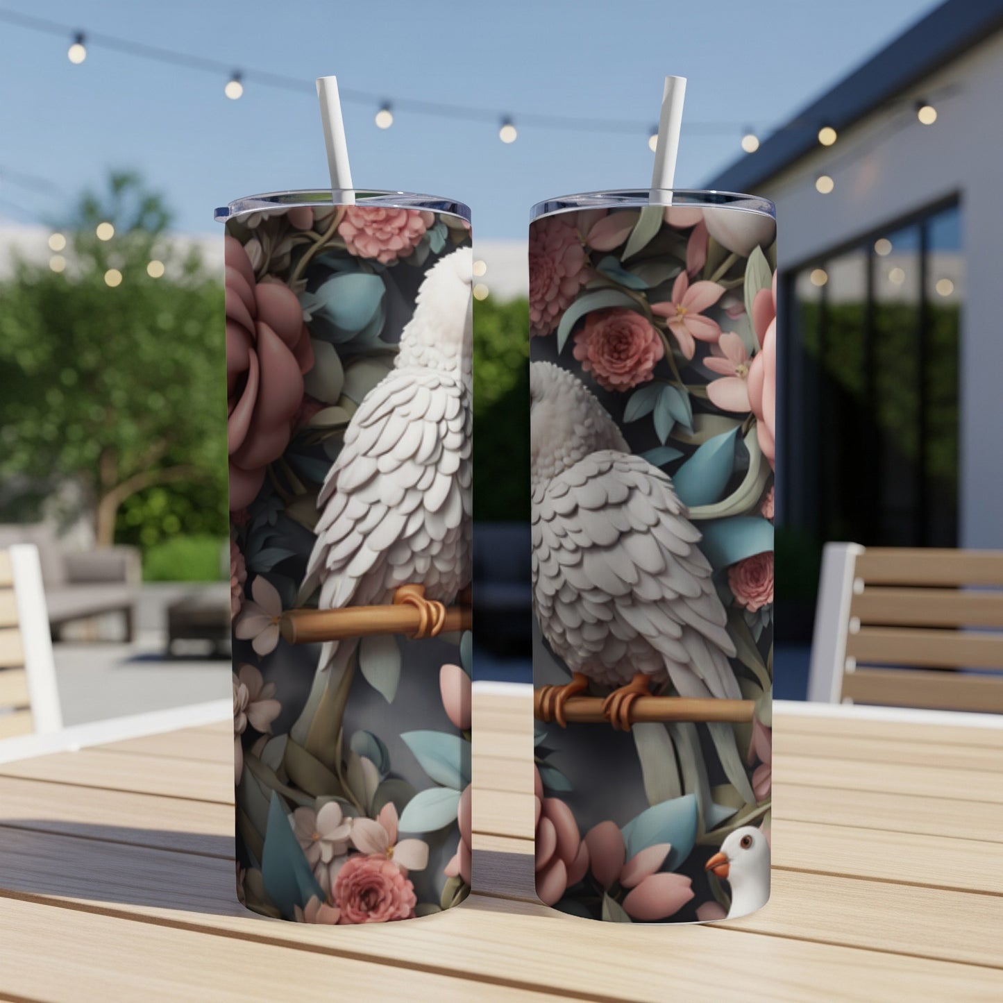 Two tumblers with white parrots and pink floral designs.