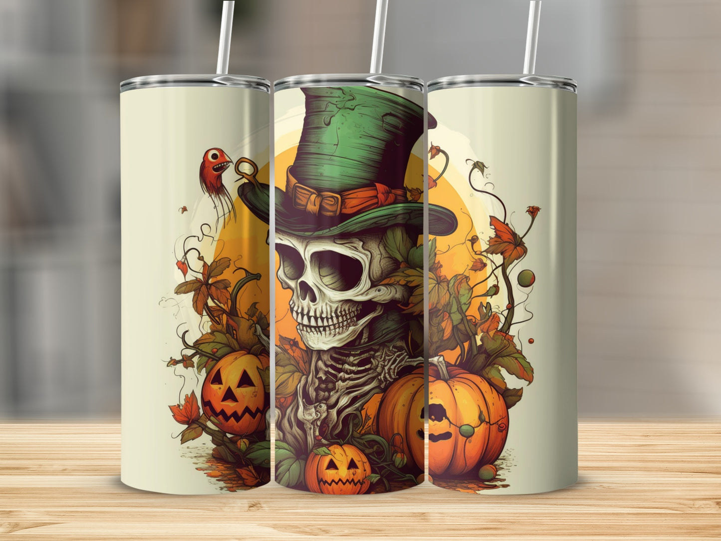 Three tumblers with a skeleton, pumpkins, and autumn leaves graphic.