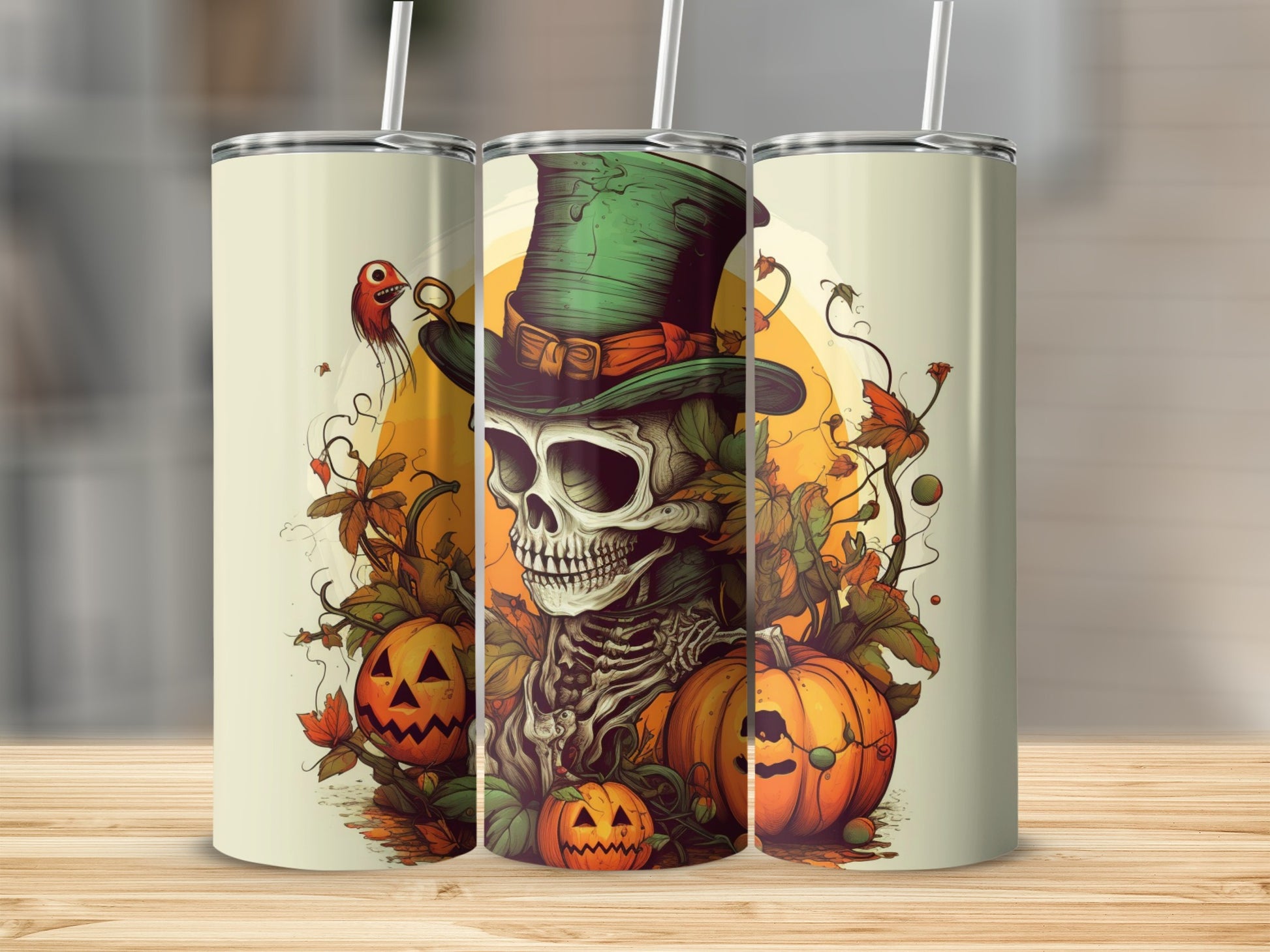 Three tumblers with a skeleton, pumpkins, and autumn leaves graphic.