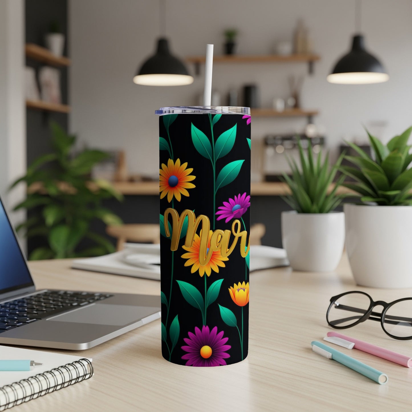 Black tumbler with colorful flowers and "Mar" text.