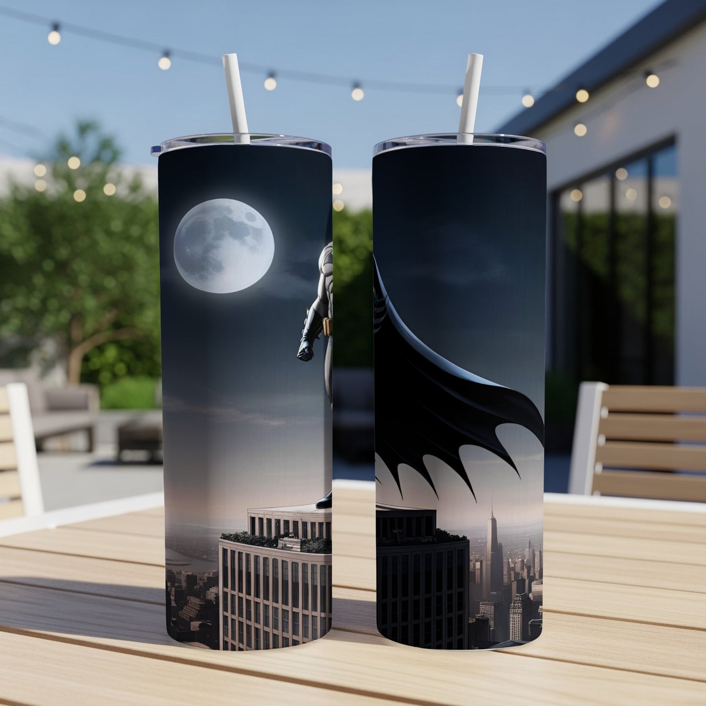 Batman standing on a skyscraper at night with the moon in the background.