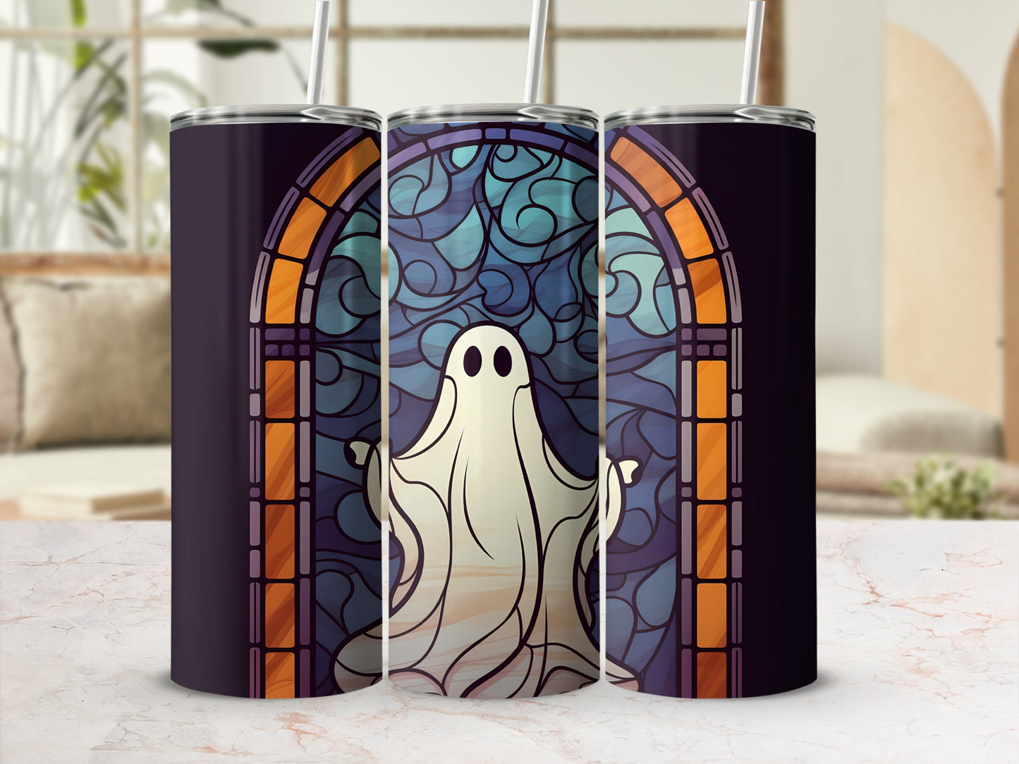 Ghost stained glass tumbler with straw, on a marble surface.
