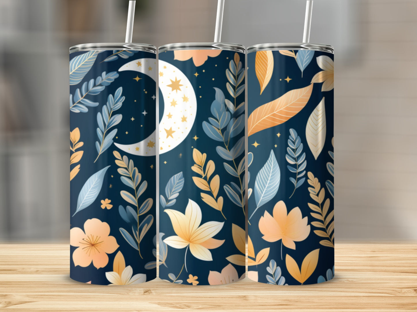 Three tumblers with a celestial floral pattern on a wooden surface.