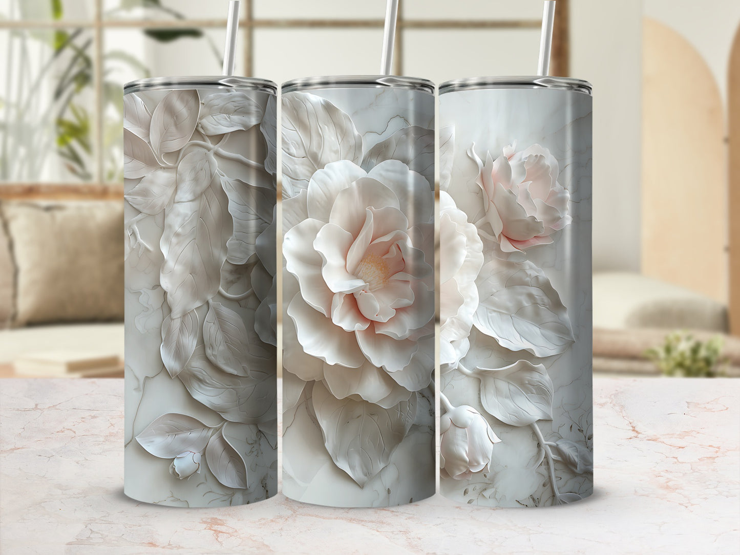 Three tumblers with detailed white and pink floral embossed designs.