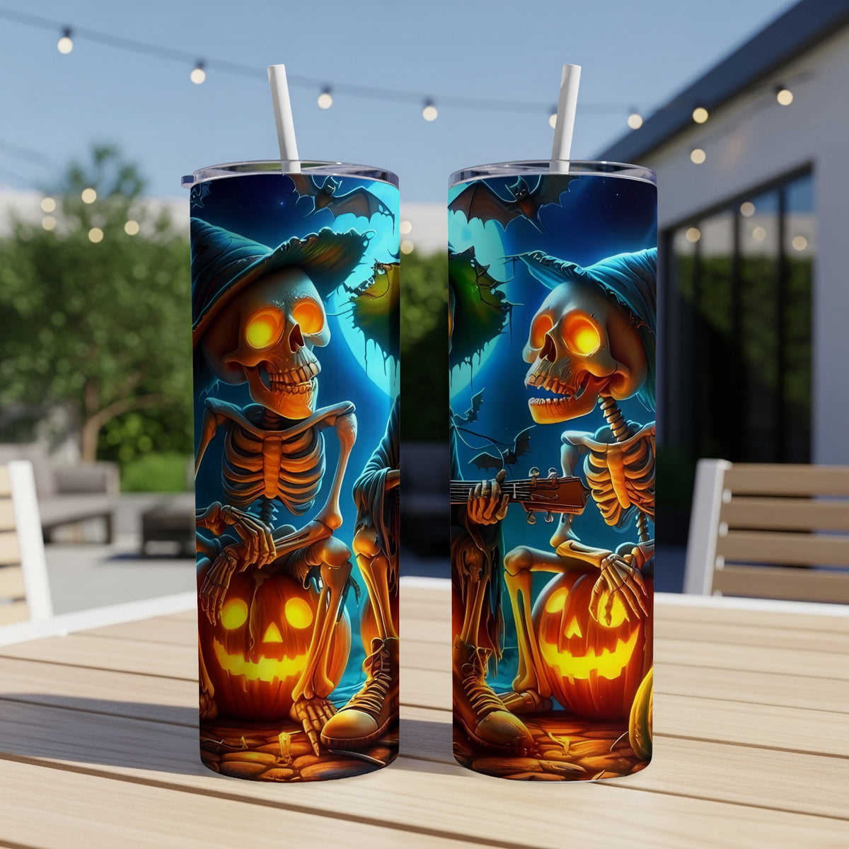 Two tumblers with Halloween skeletons playing guitar and holding pumpkins.