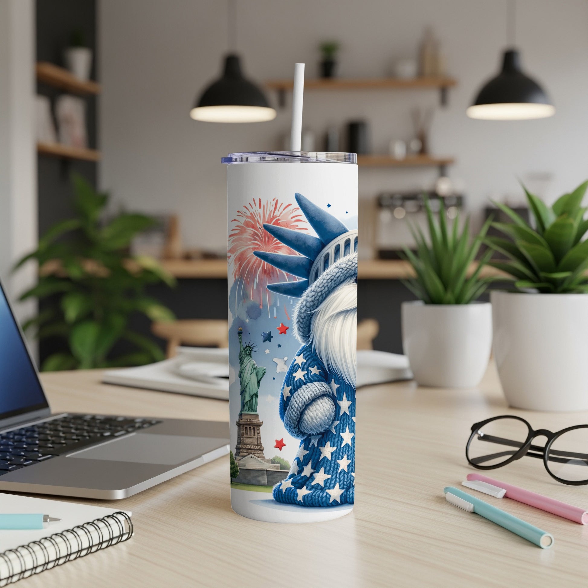 Statue of Liberty gnome with fireworks and stars design on a white tumbler.