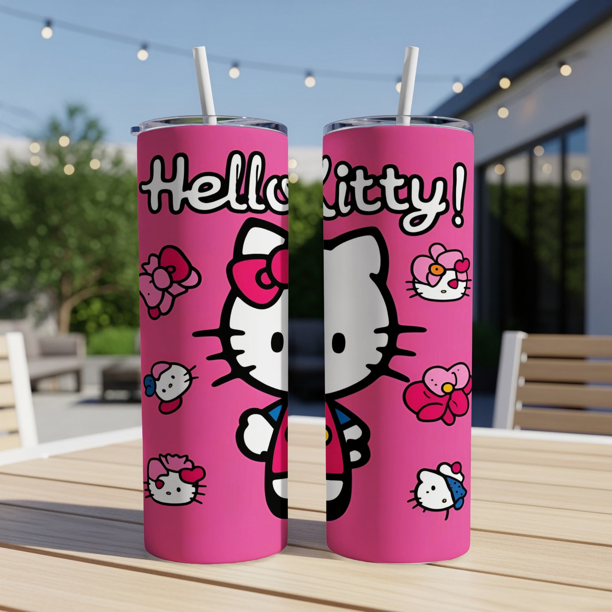 Two pink tumblers with Hello Kitty characters and flowers, outdoors.
