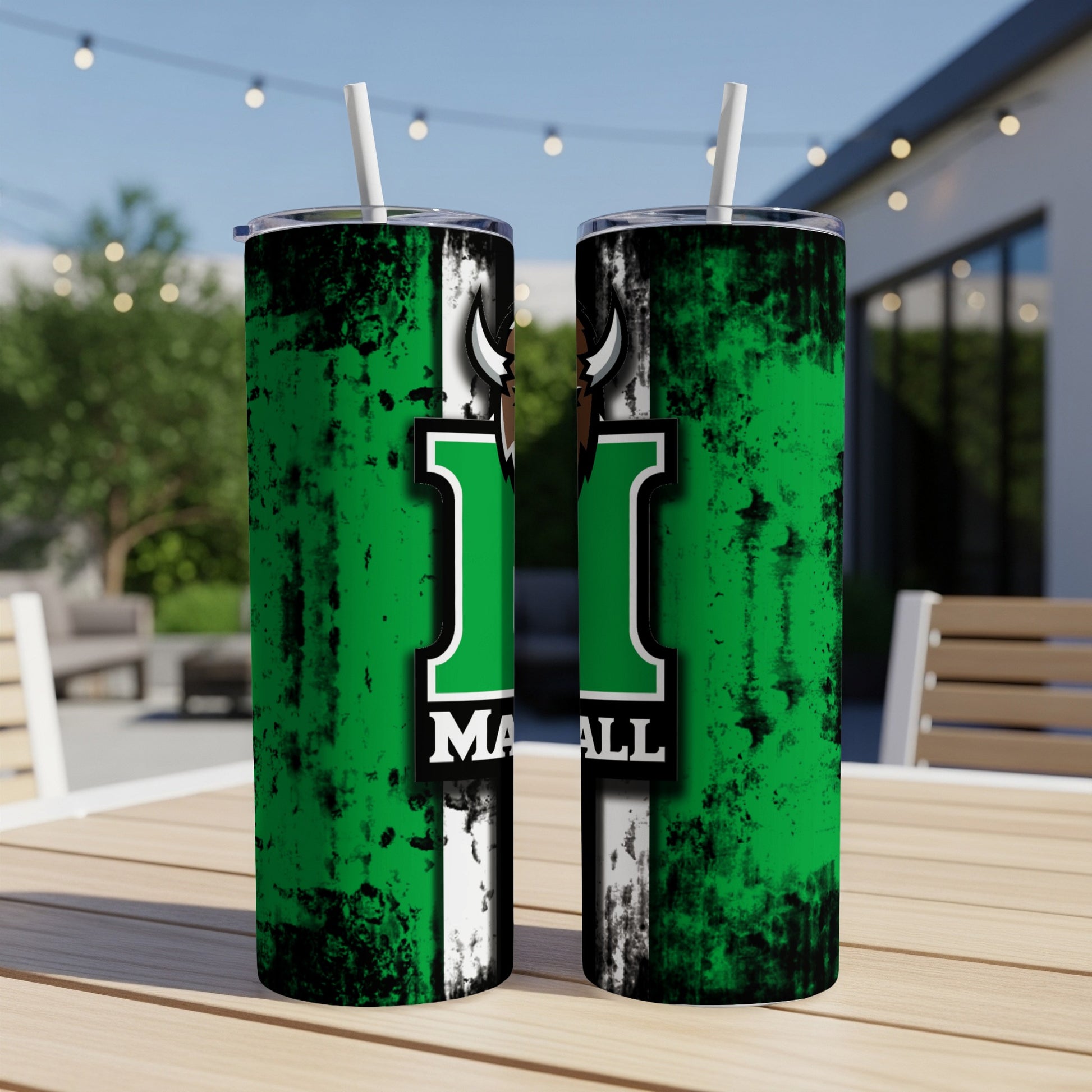 Green and black Marshall Thundering Herd tumblers with white straws on a table.