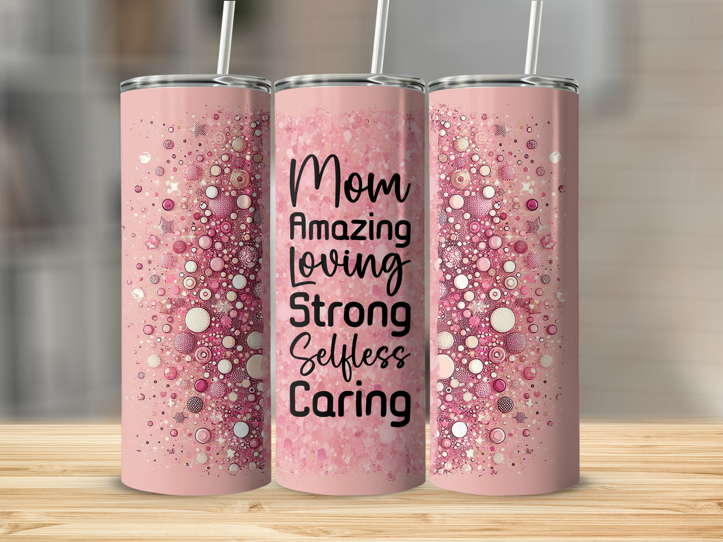Pink tumbler with "Mom Amazing Loving Strong Selfless Caring" text and sparkly design.
