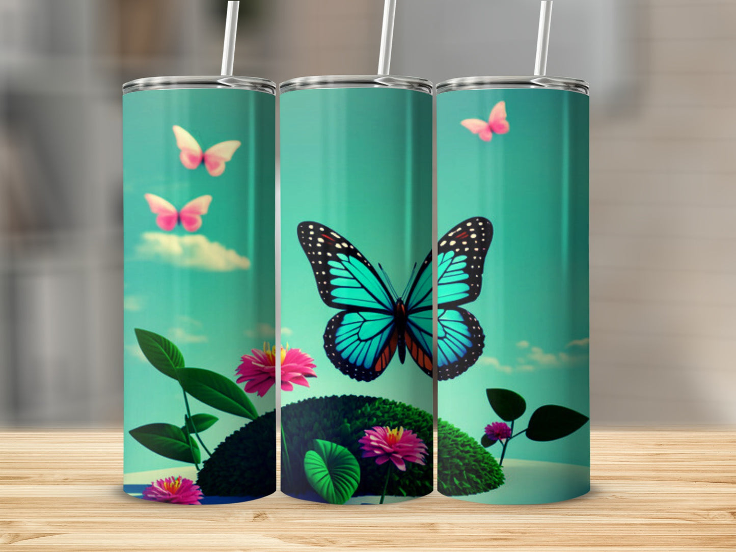 Three tumblers featuring a turquoise butterfly and pink flowers on a blue background.
