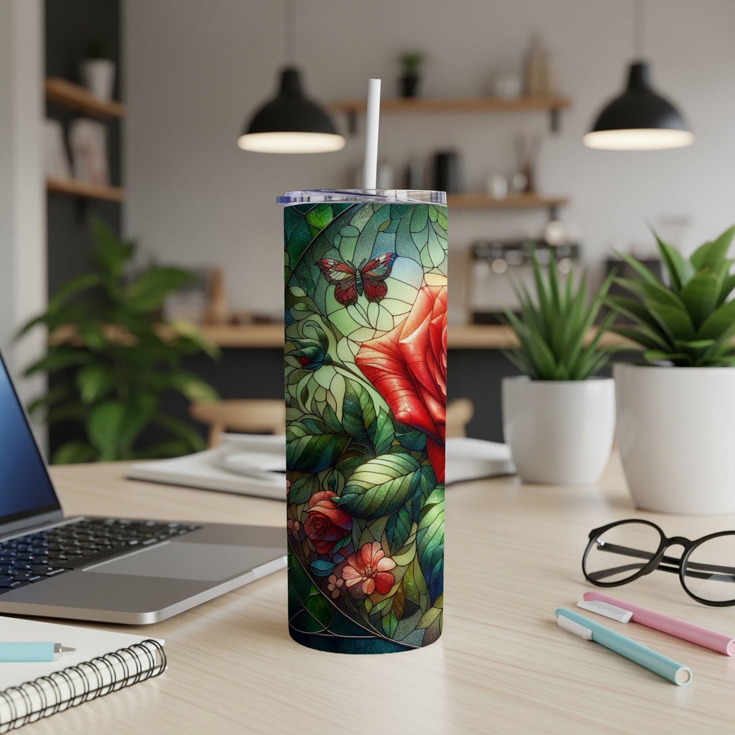 Floral stained glass design with a red rose and butterfly on a tumbler.