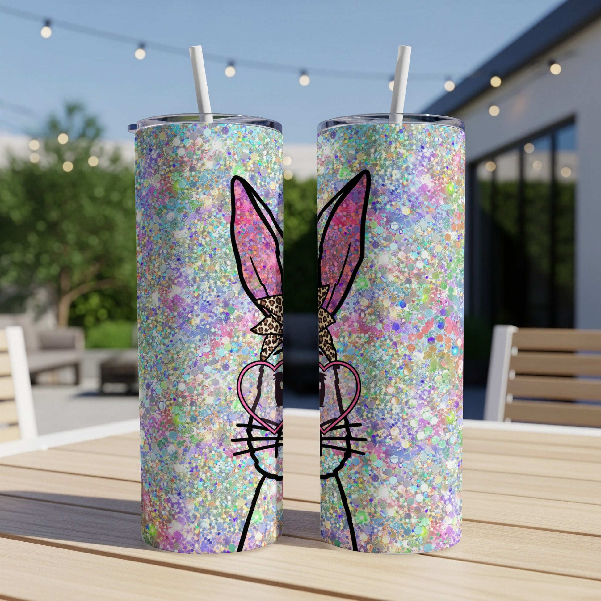Two tall tumblers with a glittery Easter bunny design and heart-shaped glasses.