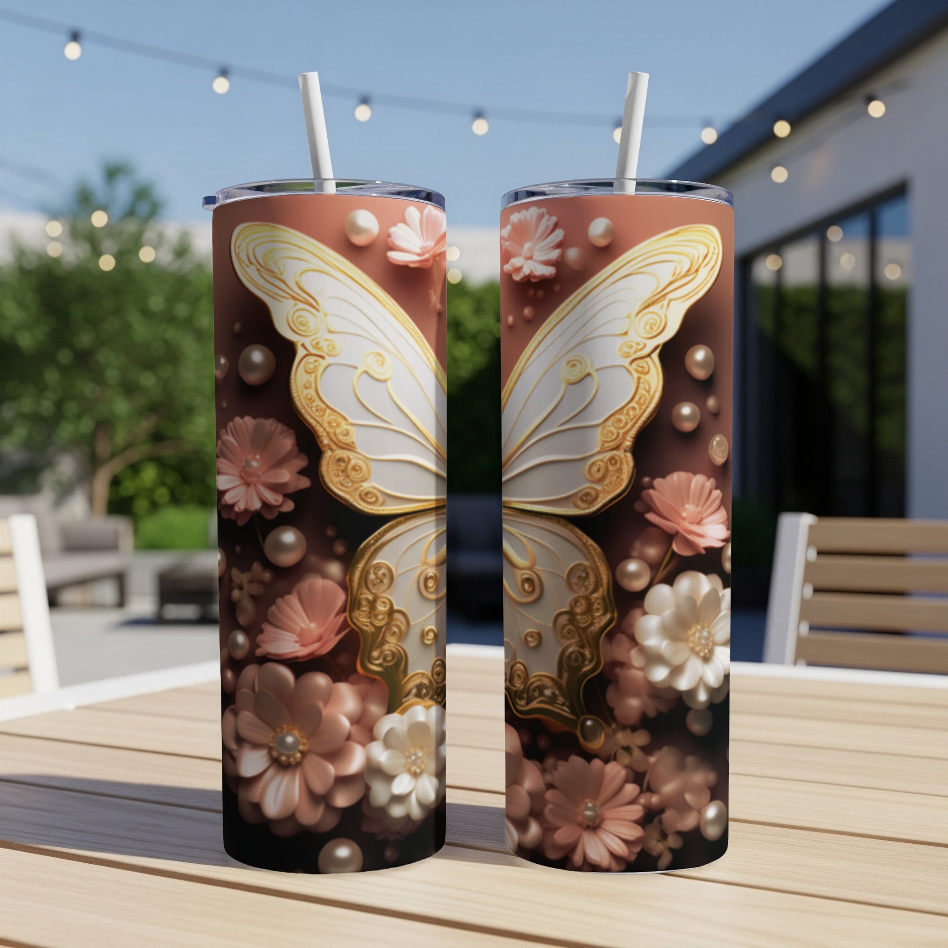 Two tall tumblers with ornate white butterfly wings and floral designs.
