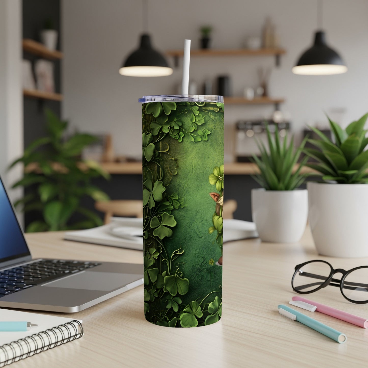 Green tumbler with shamrock pattern, featuring a cartoon leprechaun peeking from behind leaves.