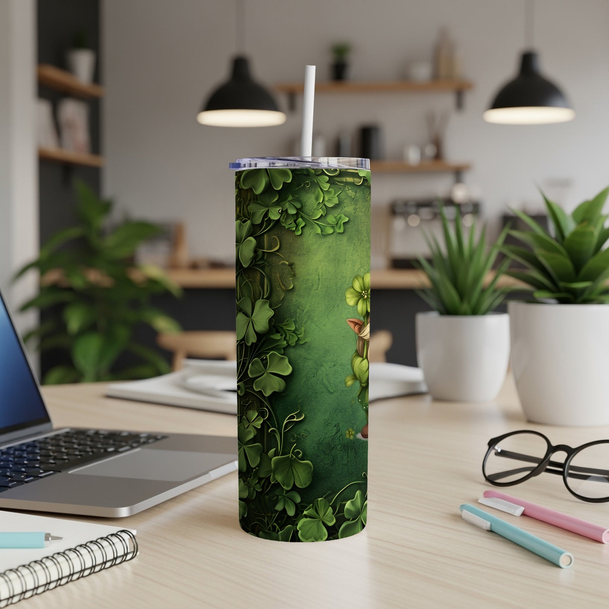 Green tumbler with shamrock pattern, featuring a cartoon leprechaun peeking from behind leaves.