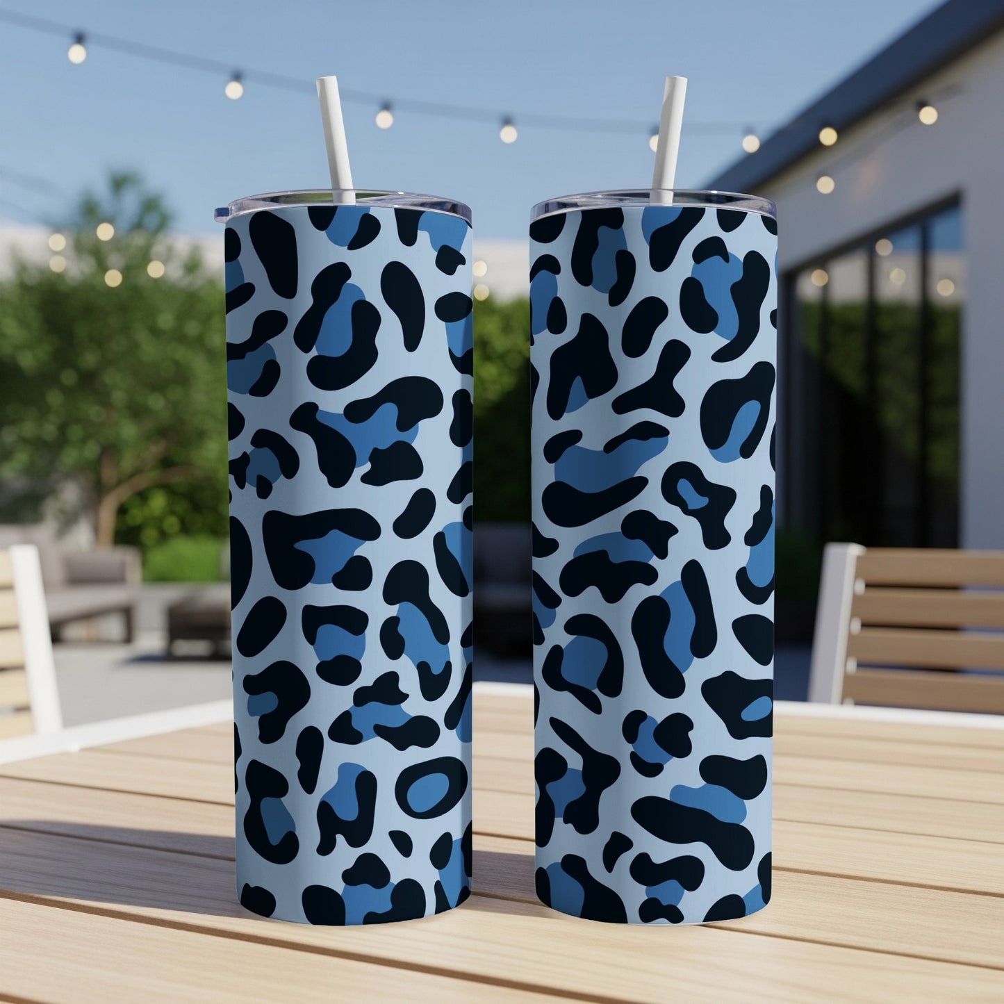 Two tumblers with a blue and black camouflage-style leopard print pattern.