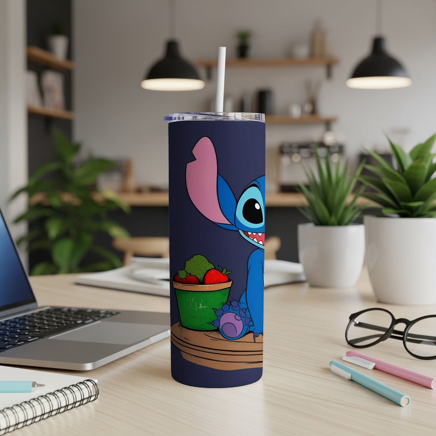 Stitch holding a bucket of strawberries on a blue tumbler with a straw.