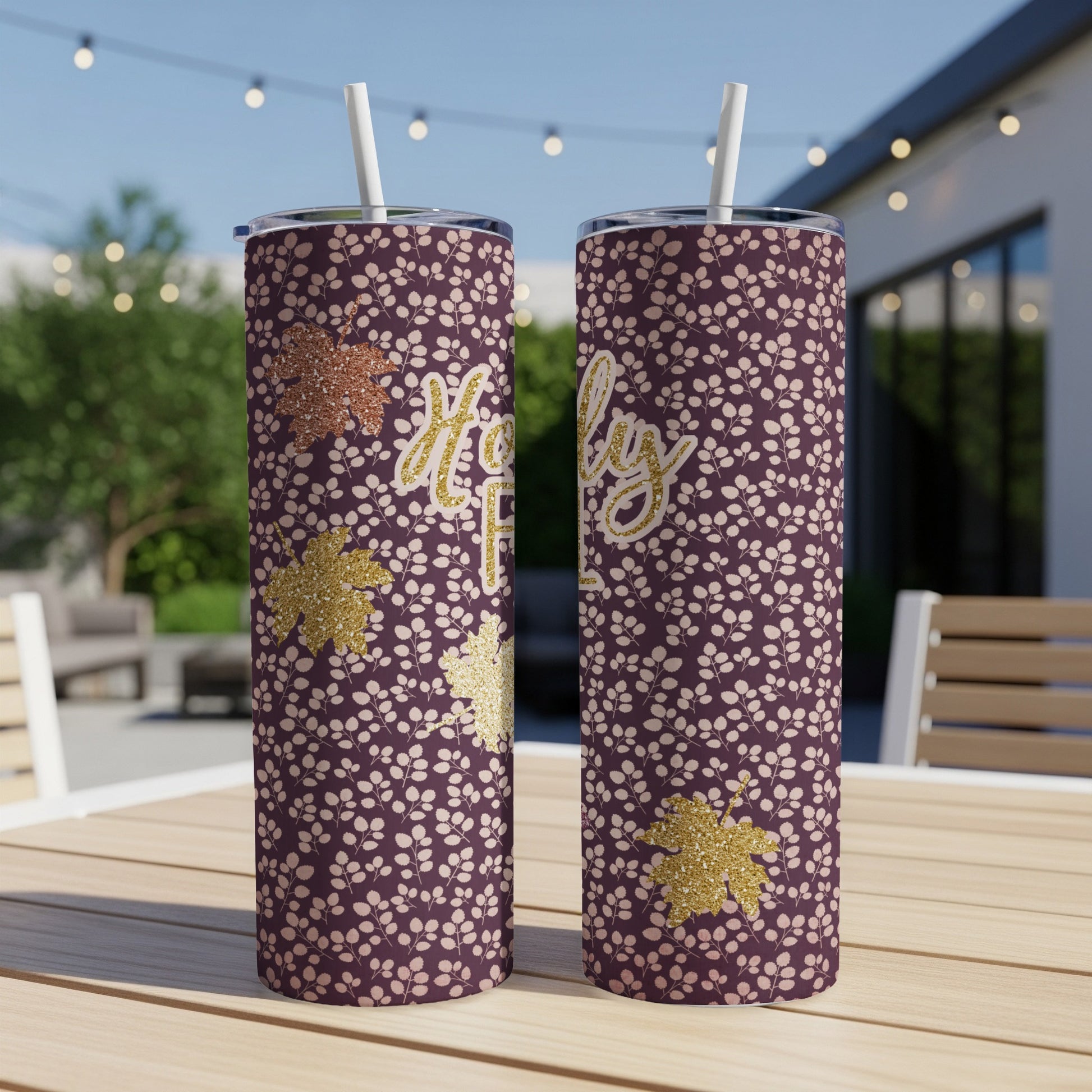 Two purple tumblers with a floral pattern and "Holly Jolly" text.