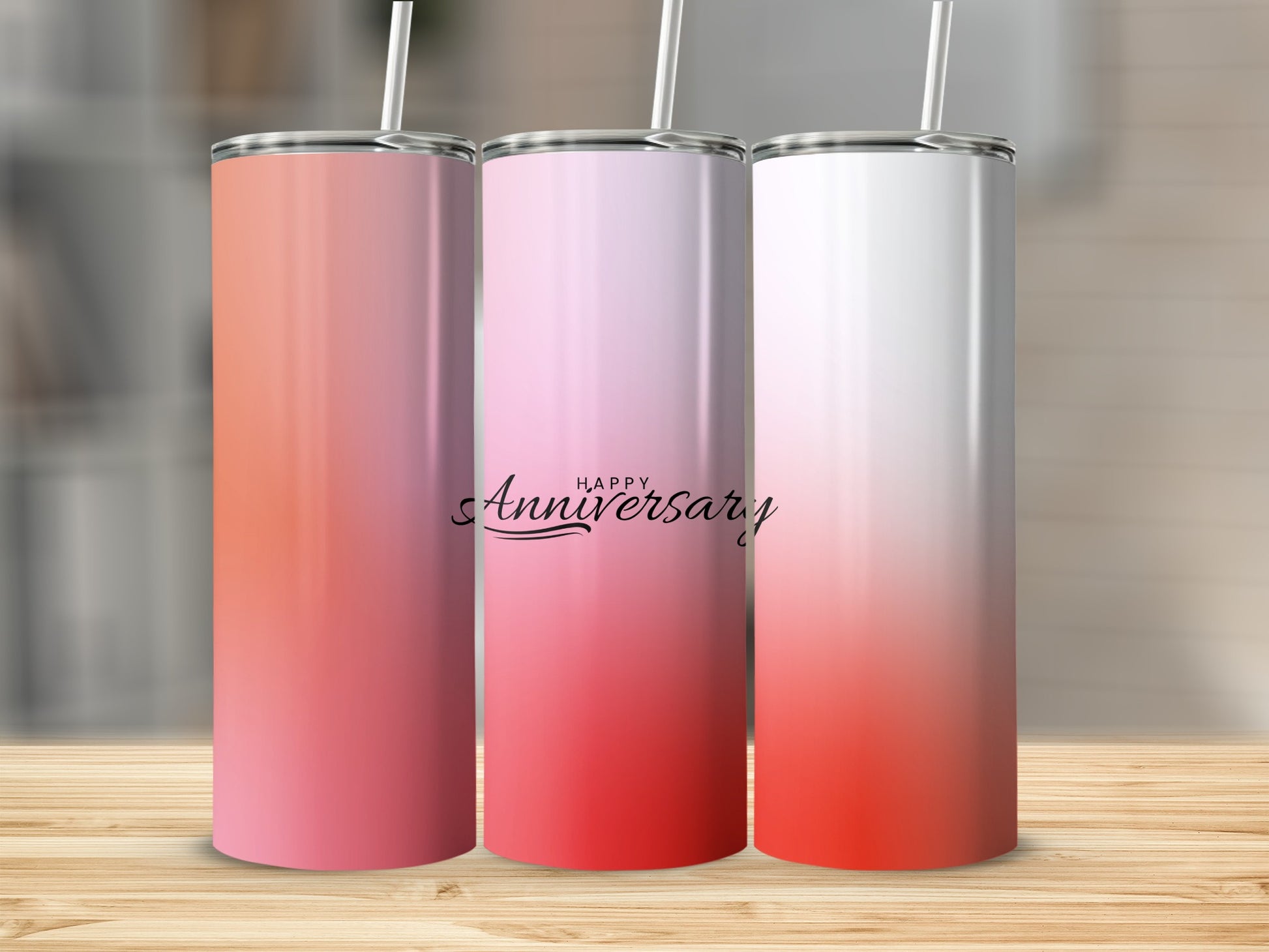 Three tumblers with ombre pink and red designs, one reading "Happy Anniversary."