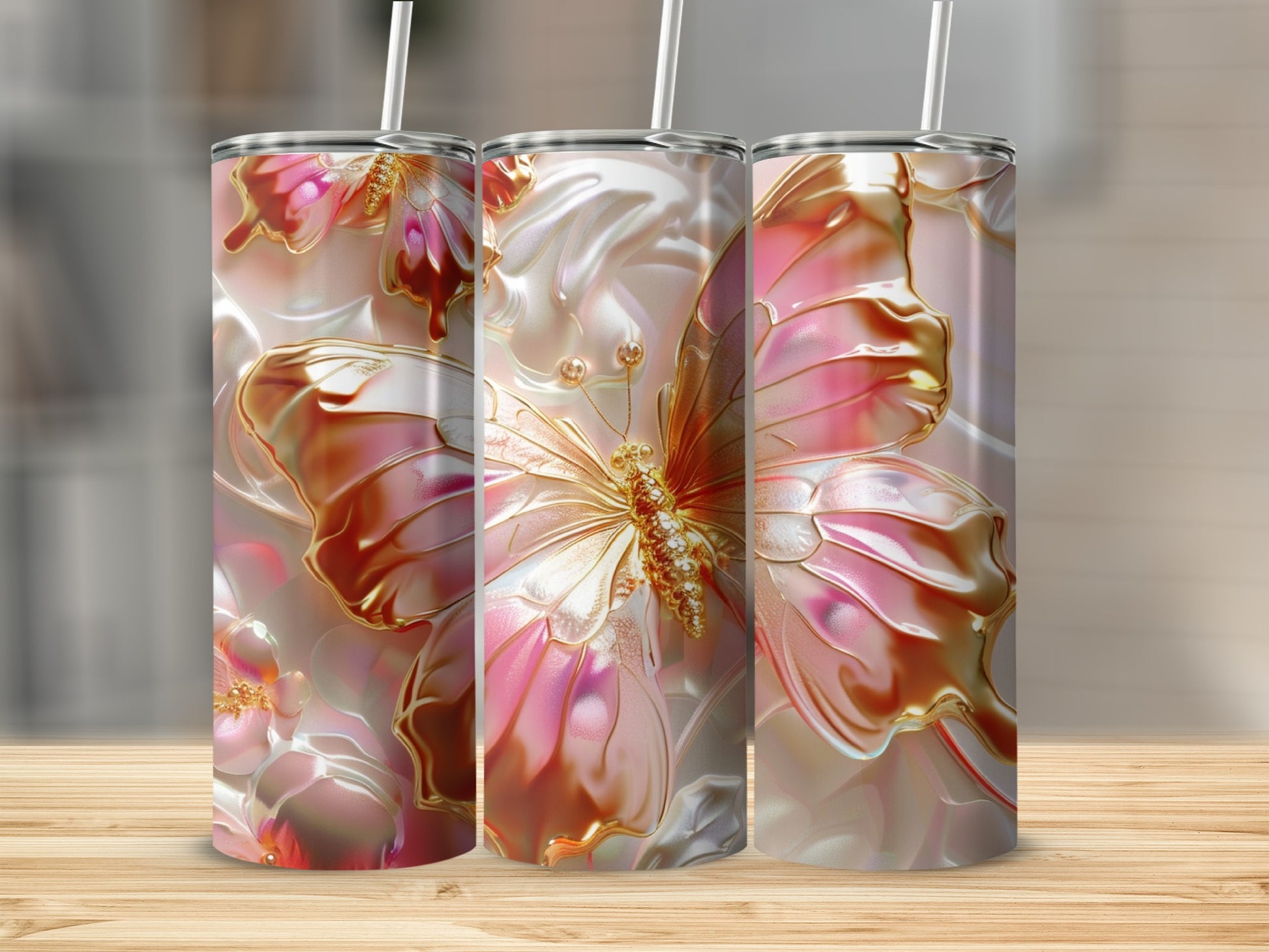 Three iridescent tumblers with a raised butterfly and floral design.