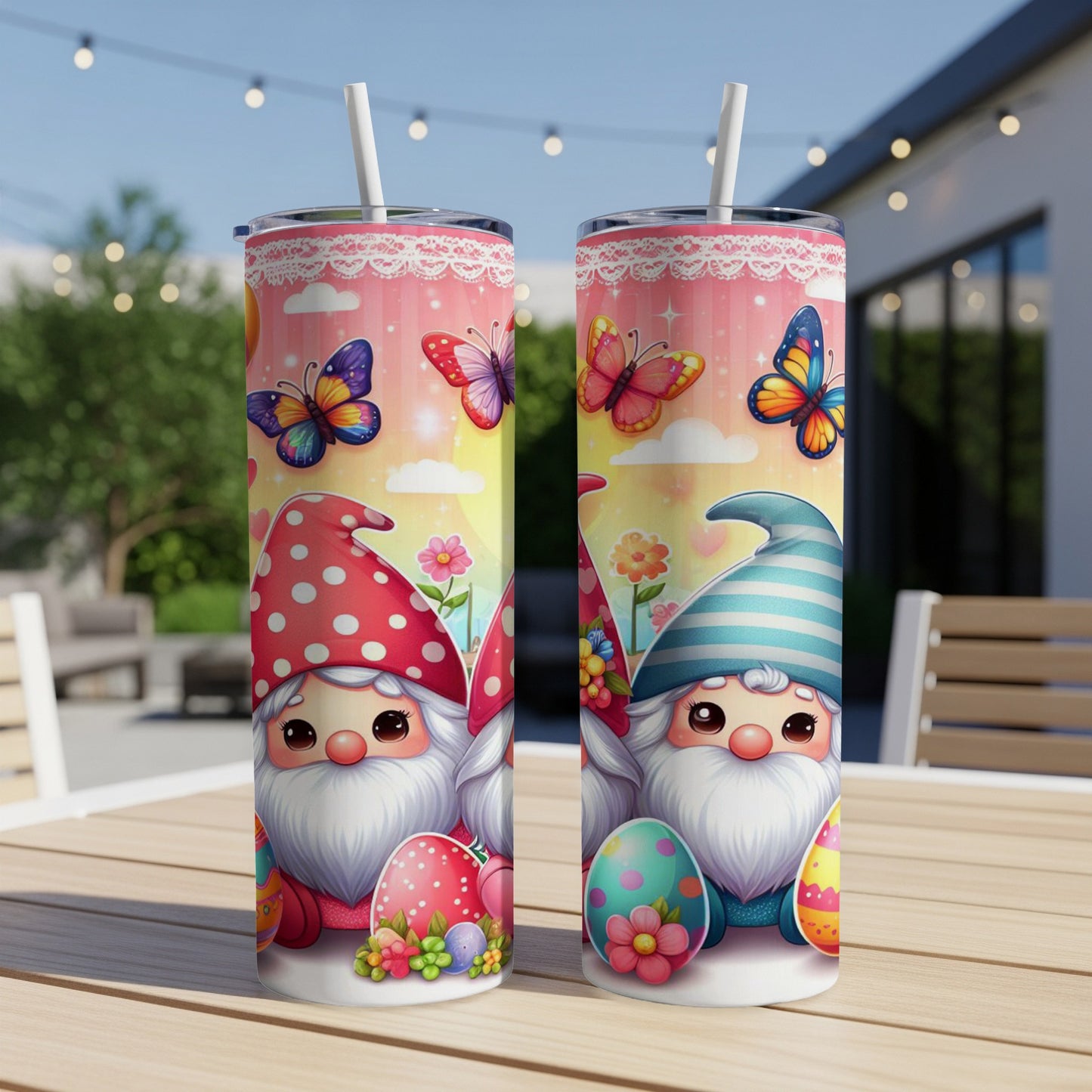 Two tumblers featuring gnome and Easter egg designs on a table.