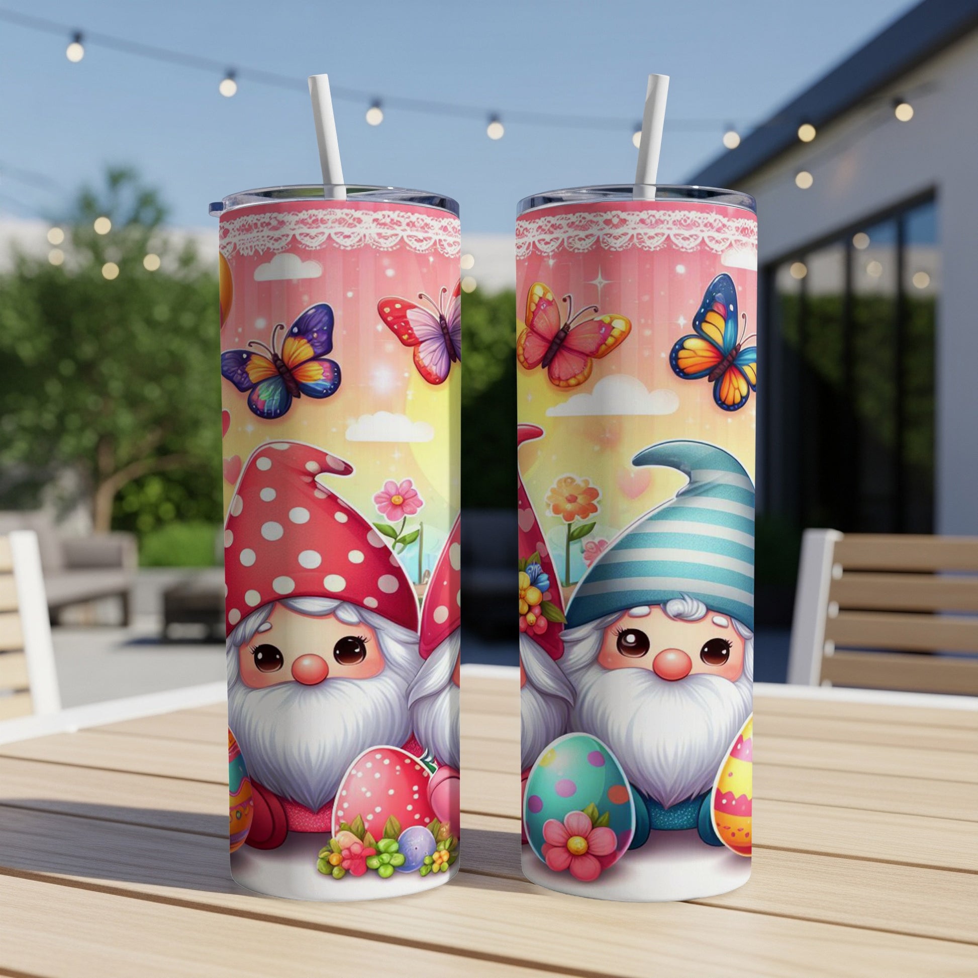Two tumblers featuring gnome and Easter egg designs on a table.