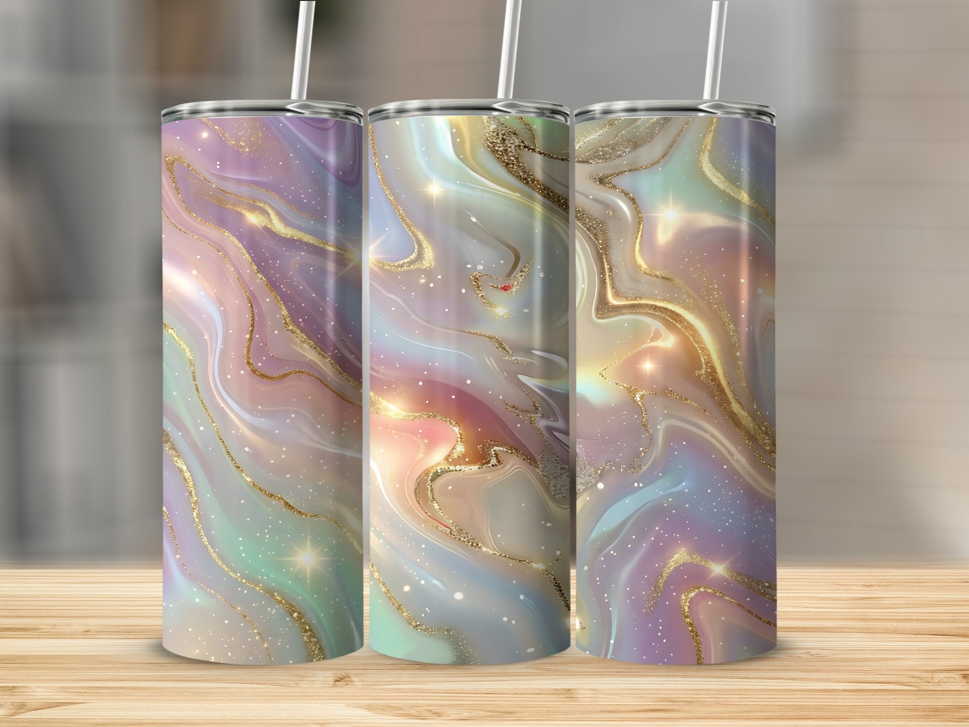 Three tall tumblers with iridescent marble designs and gold glitter accents.