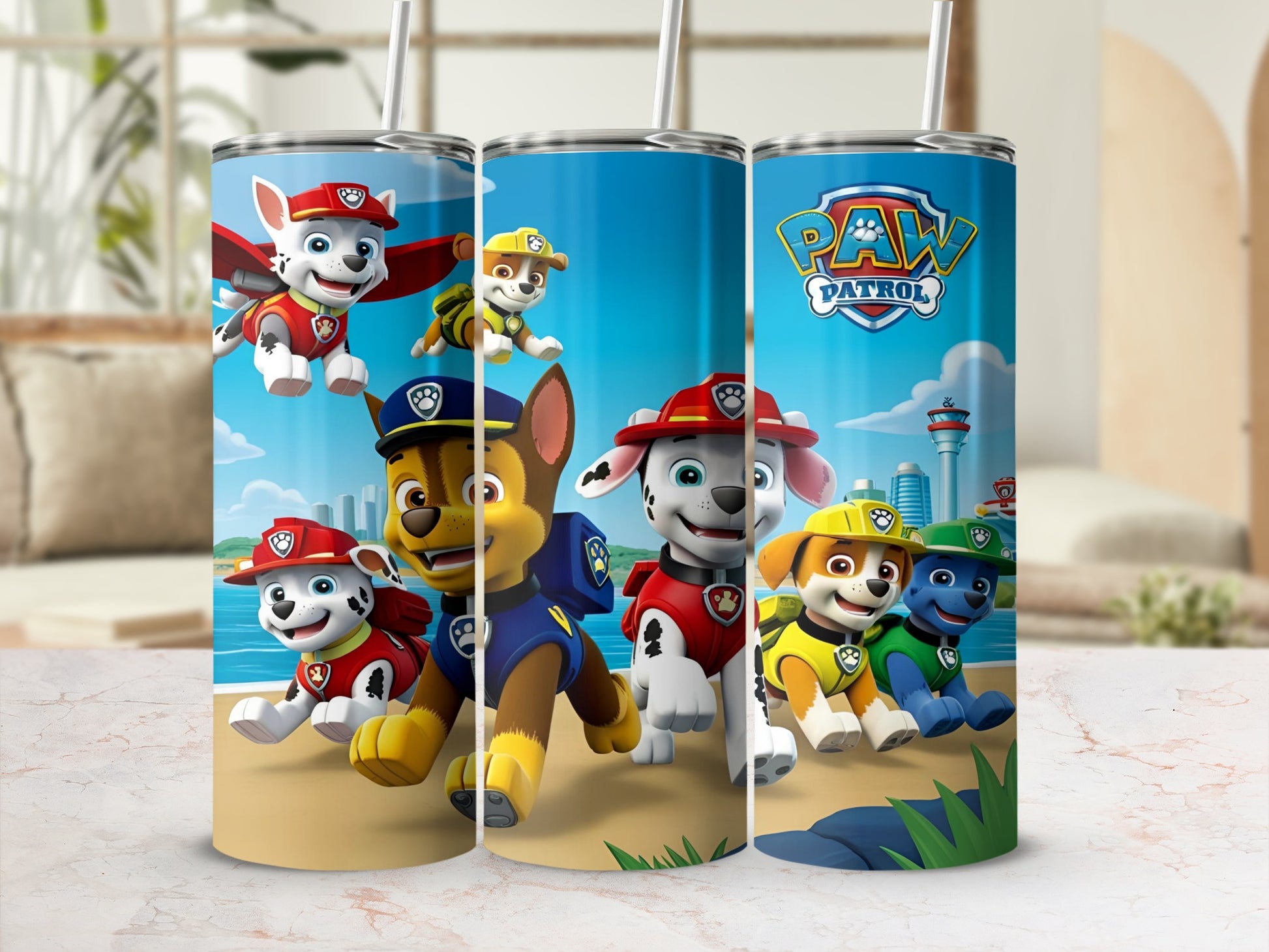 Paw Patrol characters Chase, Marshall, Skye, and Rubble on a beach.