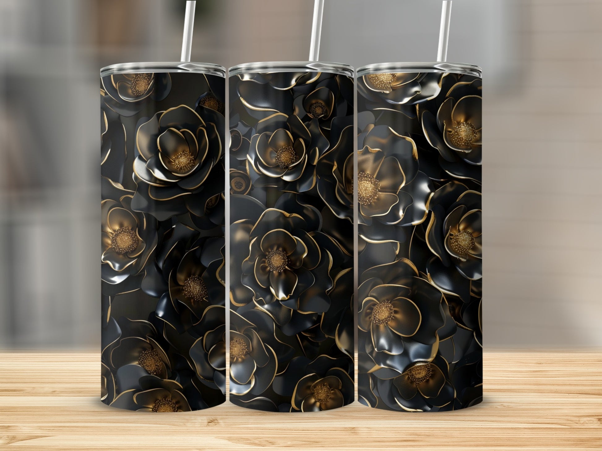 Three tumblers featuring a repeating pattern of black and gold floral designs.