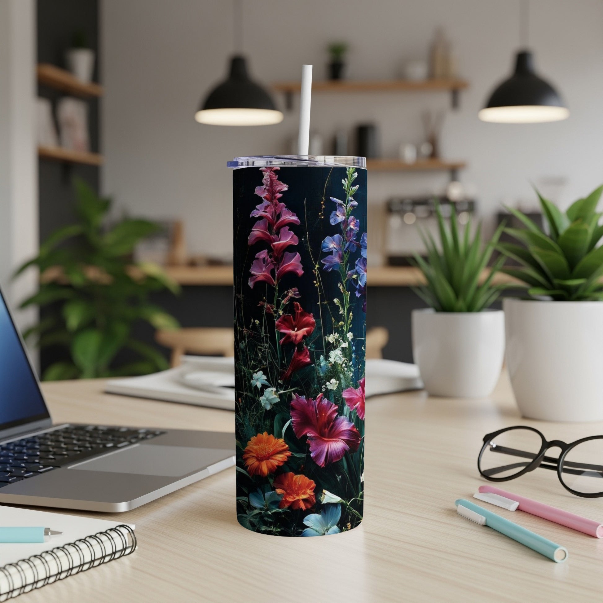 Tall floral tumbler with pink, purple, and orange flowers on a dark background.