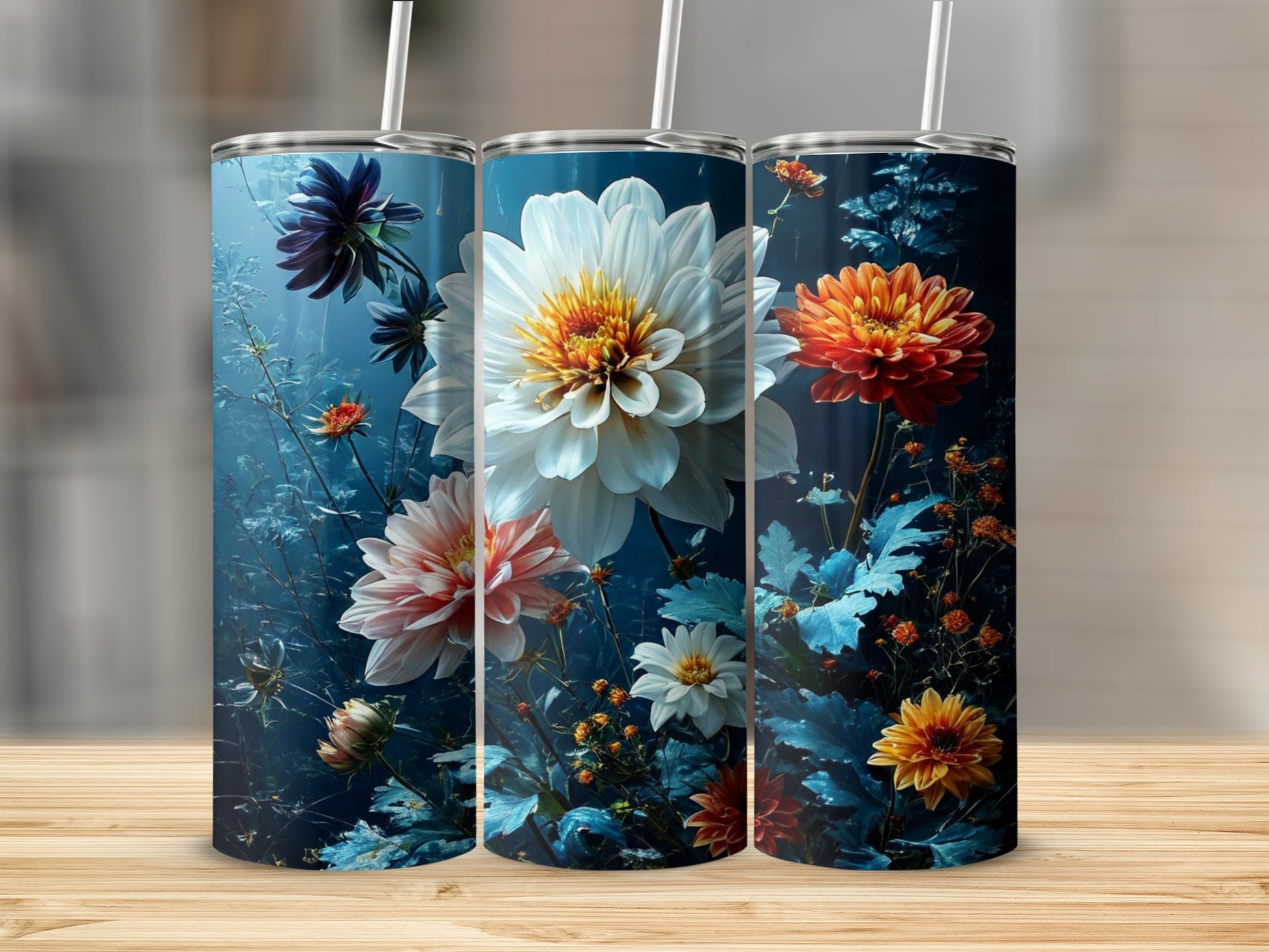 Three tumblers with floral designs featuring white, pink, and orange dahlia flowers.