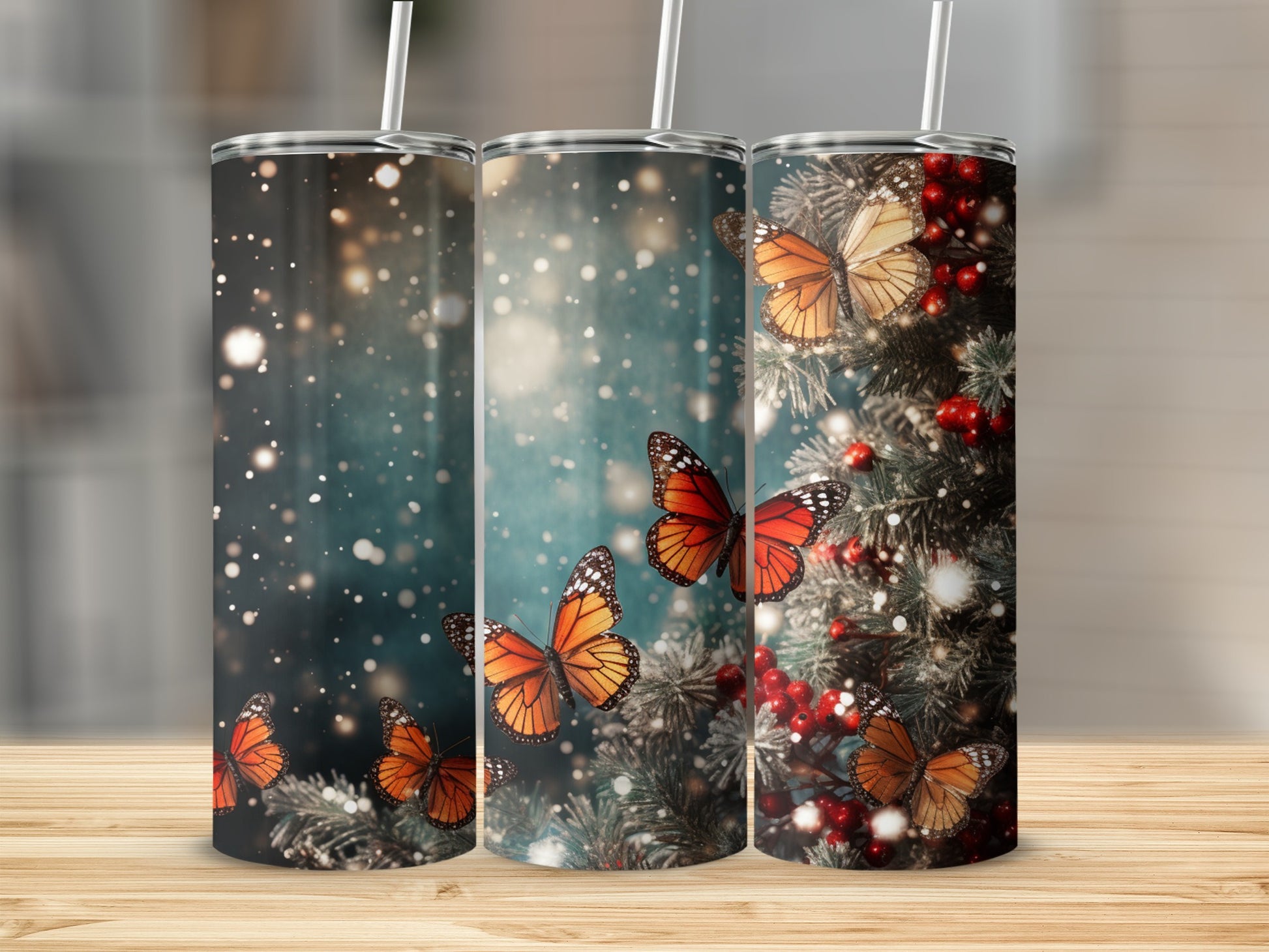 Three tumblers with orange butterflies and pine branches.
