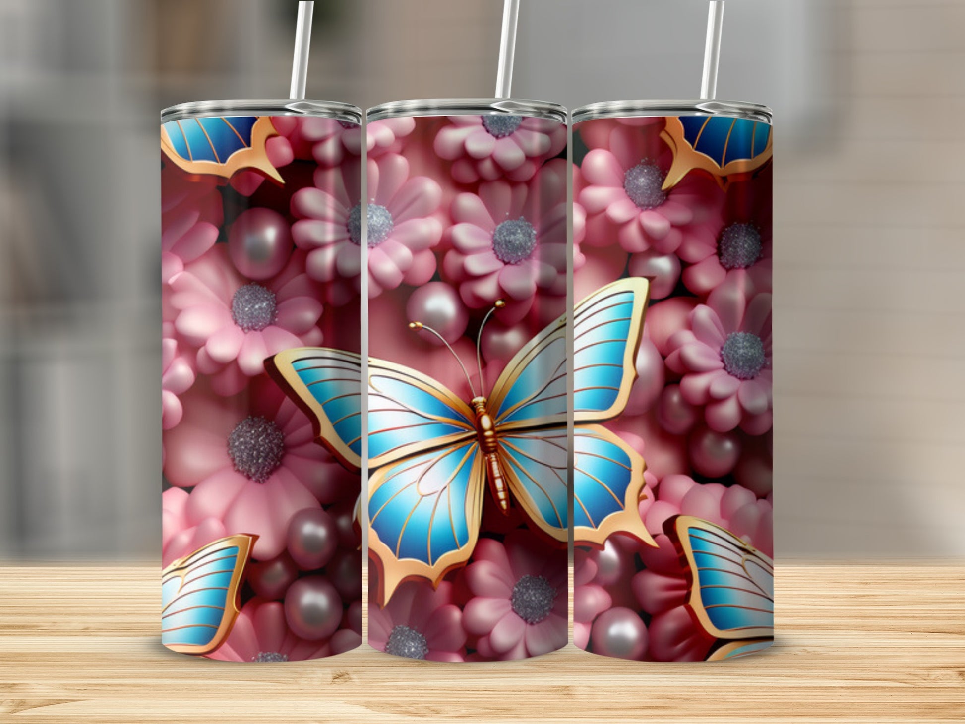 Blue butterfly with pink flowers and pearls design on three tumblers.