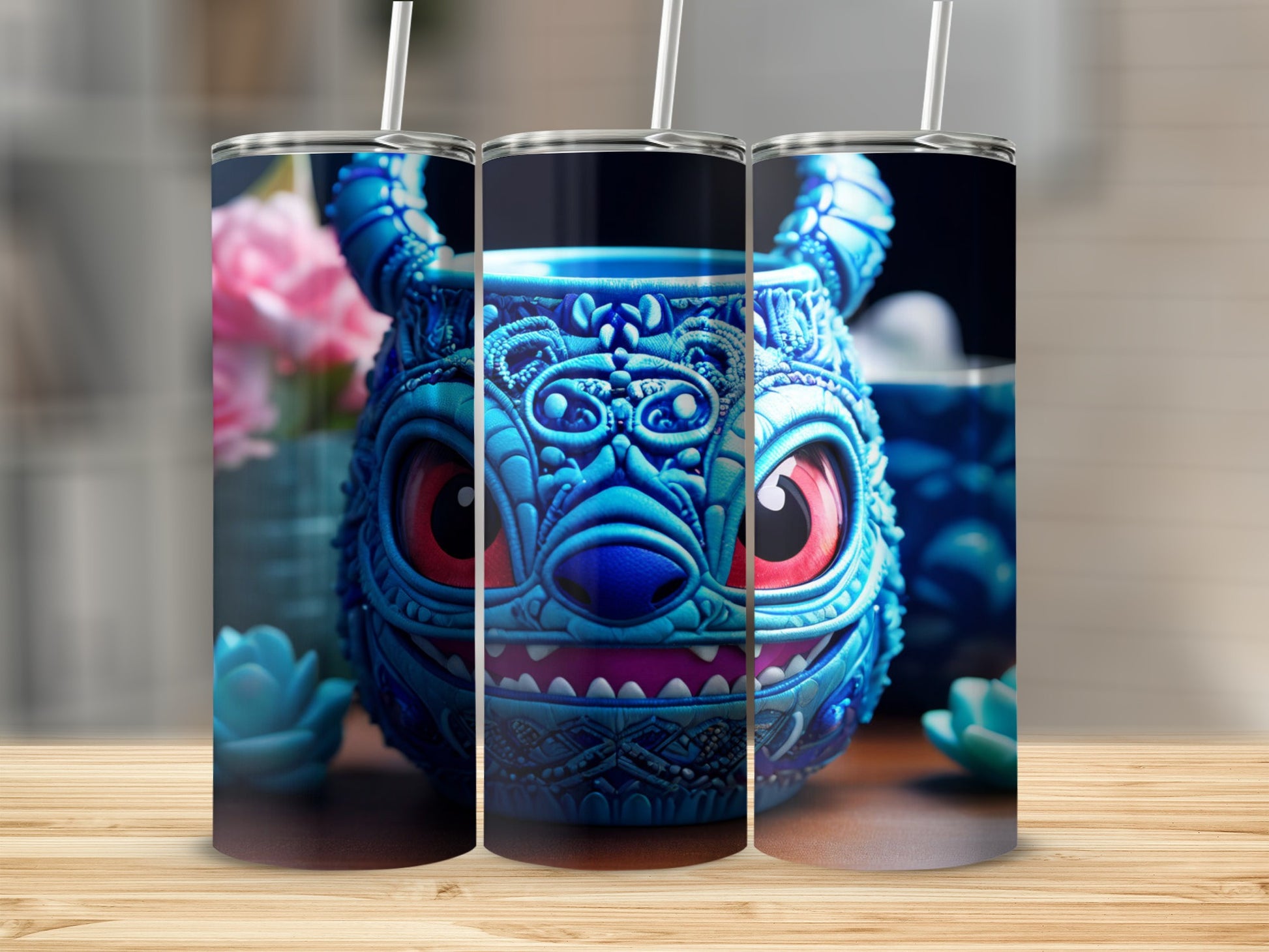 Blue monster-themed tumbler with red eyes and straw.