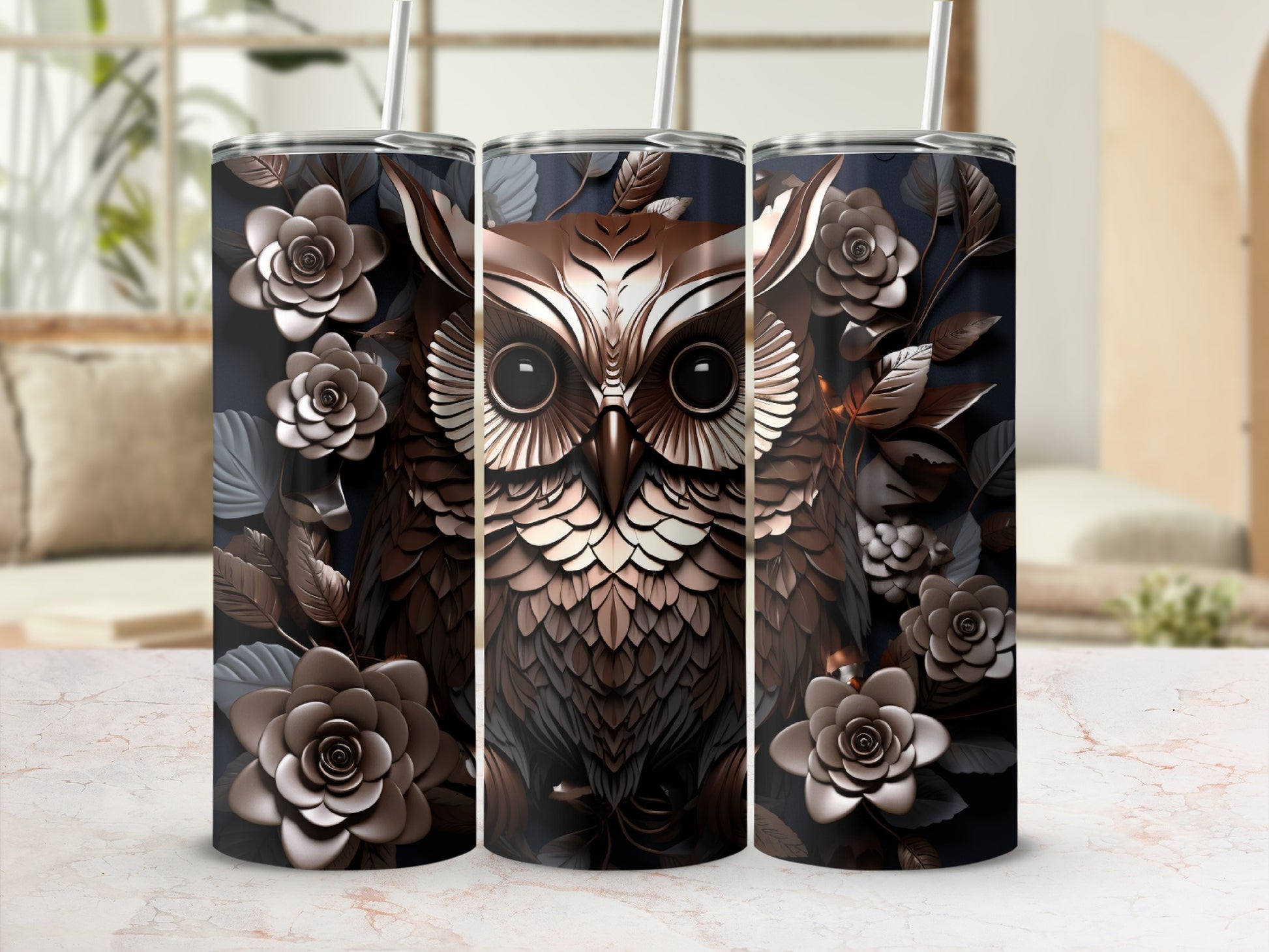 Three tumblers with a detailed owl and floral design on a blurred background.