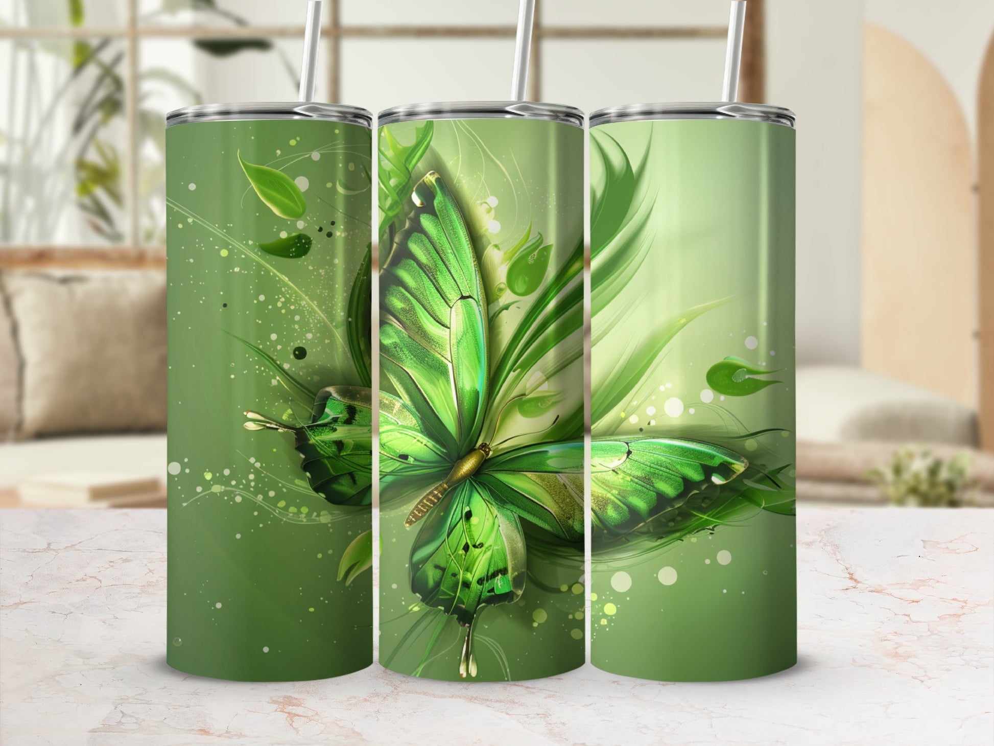 Green butterfly with leaves design on three tumblers.