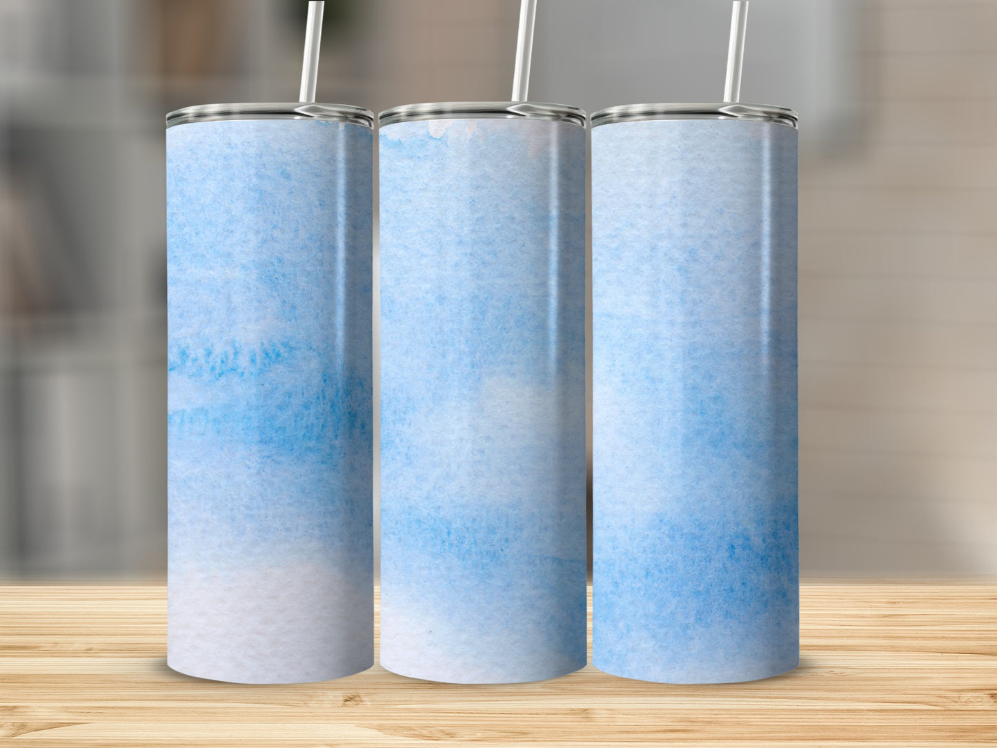 Three tall tumblers with blue watercolor texture.