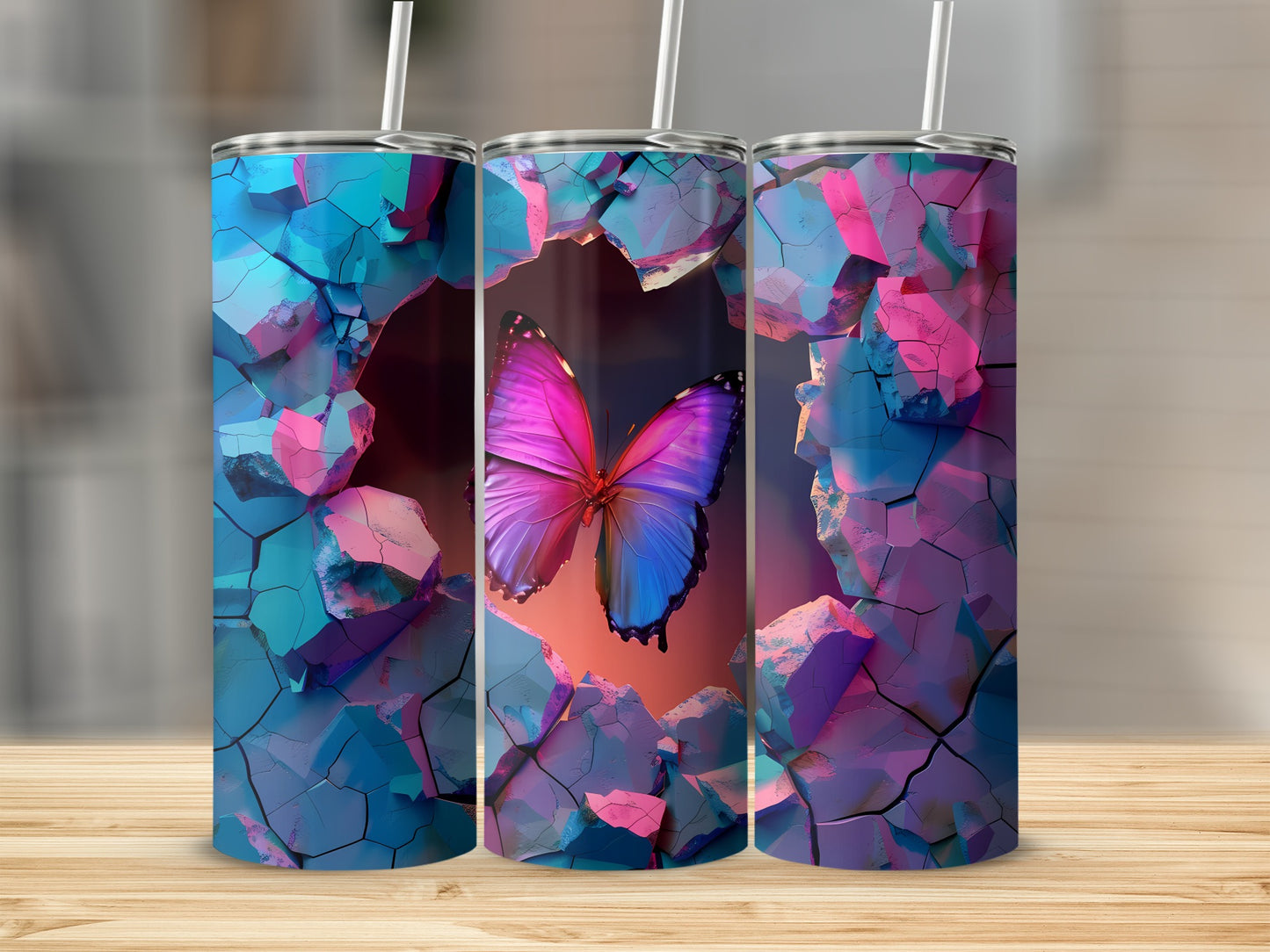 Three tumblers with a cracked earth design and a vibrant butterfly emerging.