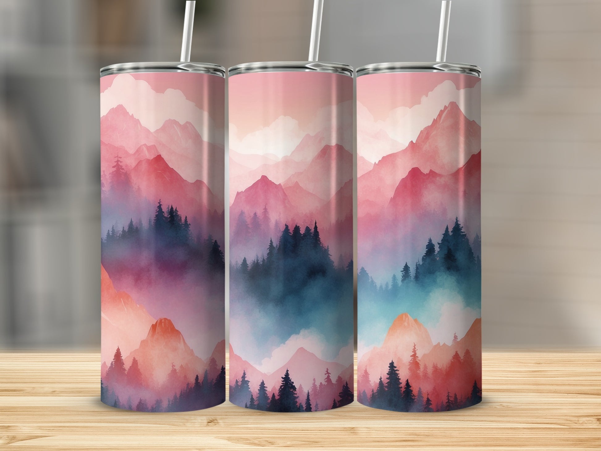 Three tumblers with a pink and blue mountain forest design.