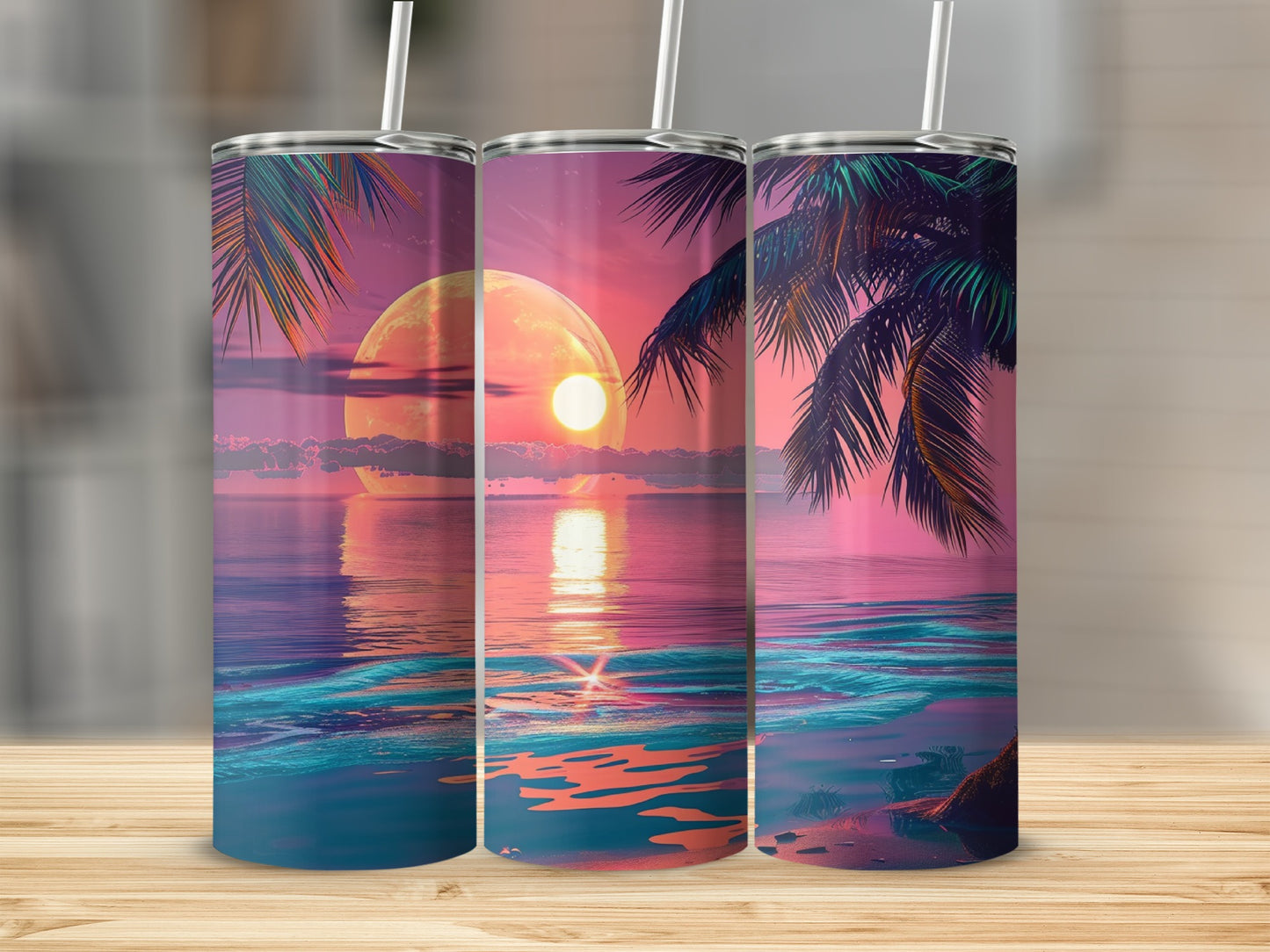 Three tumblers with a tropical sunset ocean scene and palm trees.